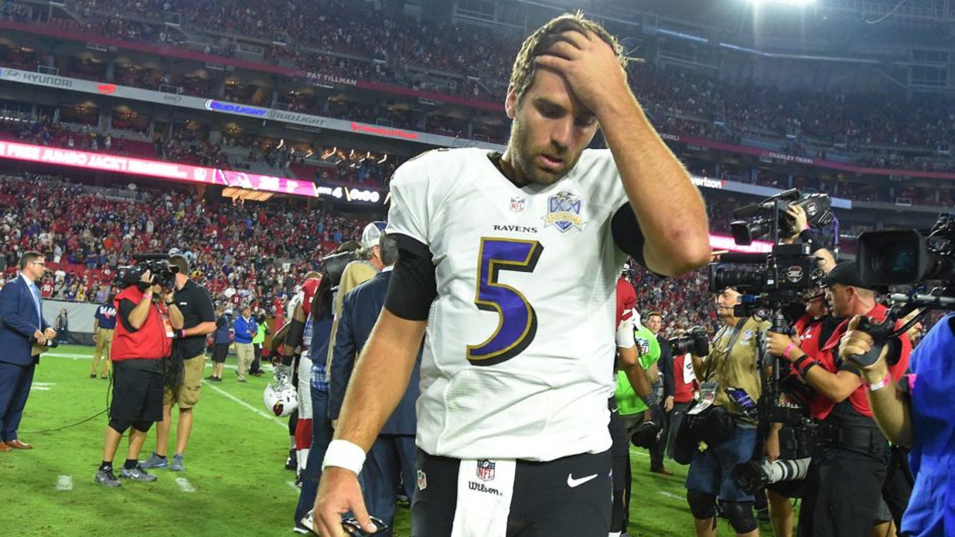 Baltimore Ravens quarterback Joe Flacco walks off the field after losing the game on an interception on Monday, Oct. 26, 2015, at the University of Phoenix Stadium in Glendale, Ariz. (Lloyd Fox/Baltimore Sun/TNS via Getty Images)