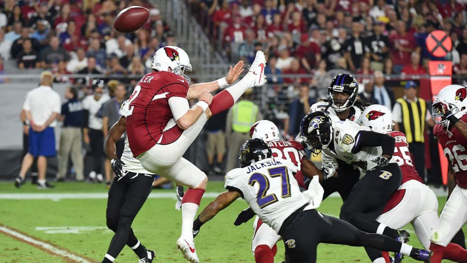 GLENDALE, AZ - OCTOBER 26: Drew Butler's #2 of the Arizona Cardinals punt is blocked by cornerback Asa Jackson #27 of the Baltimore Ravens in the fourth quarter of the NFL game at University of Phoenix Stadium on October 26, 2015 in Glendale, Arizona. (Photo by Norm Hall/Getty Images)