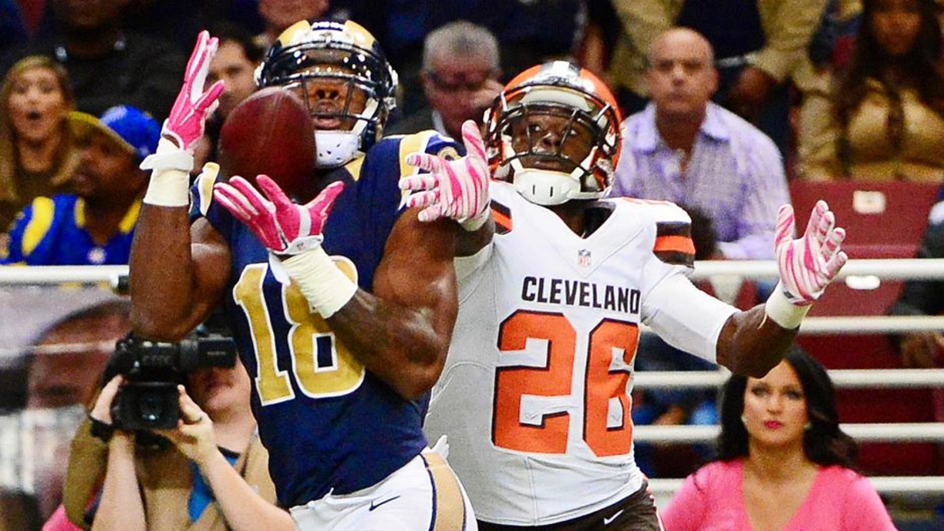 Oct 25, 2015; St. Louis, MO, USA; St. Louis Rams wide receiver Kenny Britt (18) catches a pass in the end zone as Cleveland Browns cornerback Pierre Desir (26) defends during the second half at the Edward Jones Dome. The Rams won 24-6. Mandatory Credit: Jeff Curry-USA TODAY Sports