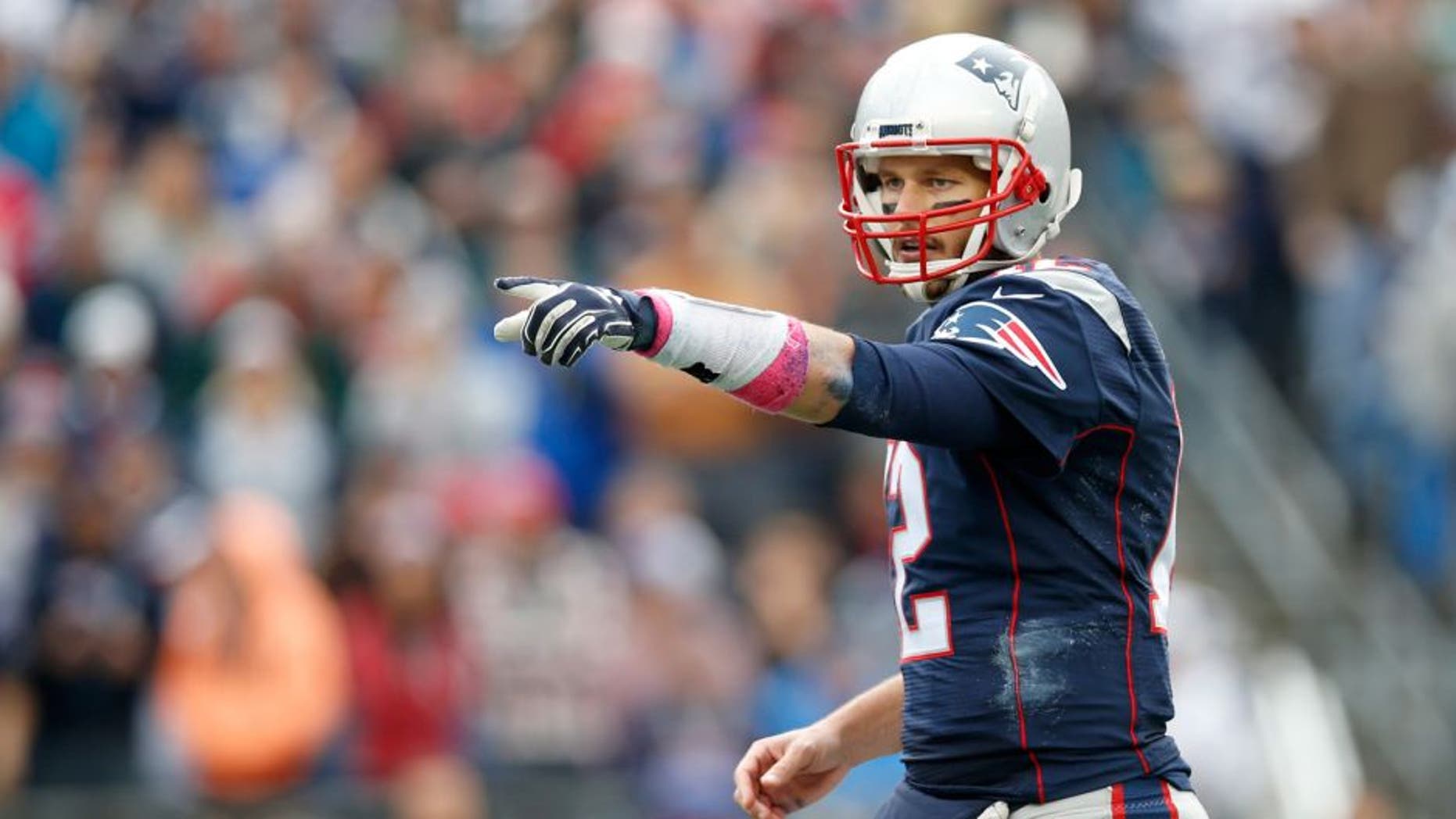 Oct 25, 2015; Foxborough, MA, USA; New England Patriots quarterback Tom Brady (12) makes an adjustment at the line of scrimmage during the third quarter against the New York Jets at Gillette Stadium. The New England Patriots won 30-23. Mandatory Credit: Greg M. Cooper-USA TODAY Sports