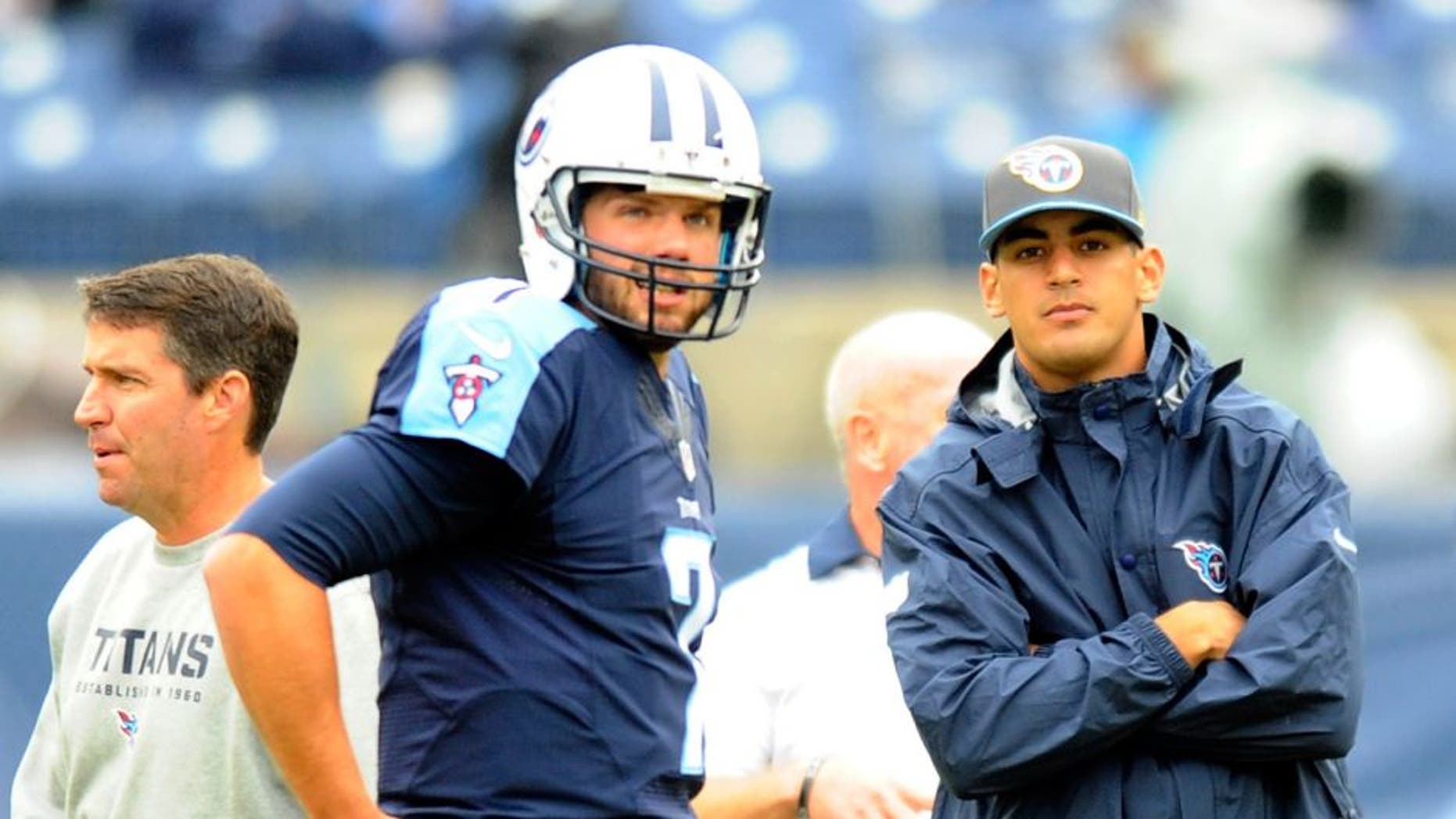 Oct 25, 2015; Nashville, TN, USA; Tennessee Titans quarterback Marcus Mariota (right) looks on as quarterback Zach Mettenberger (7) will get the start against the Atlanta Falcons at Nissan Stadium. Mandatory Credit: Christopher Hanewinckel-USA TODAY Sports