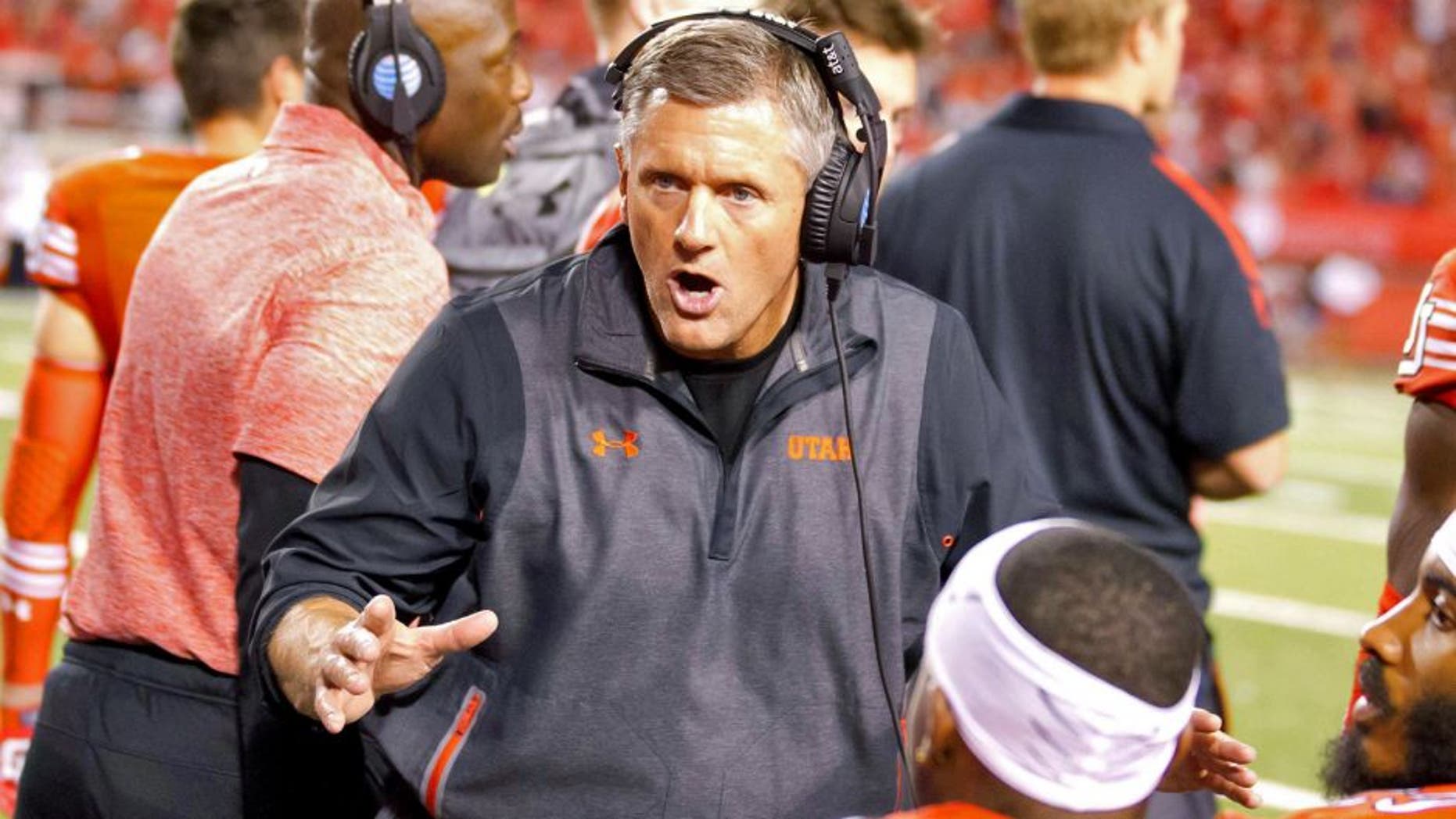 Oct 10, 2015; Salt Lake City, UT, USA; Utah Utes head coach Kyle Whittingham talks with his players during the second half against the California Golden Bears at Rice-Eccles Stadium. Utah won 30-24. Mandatory Credit: Russ Isabella-USA TODAY Sports