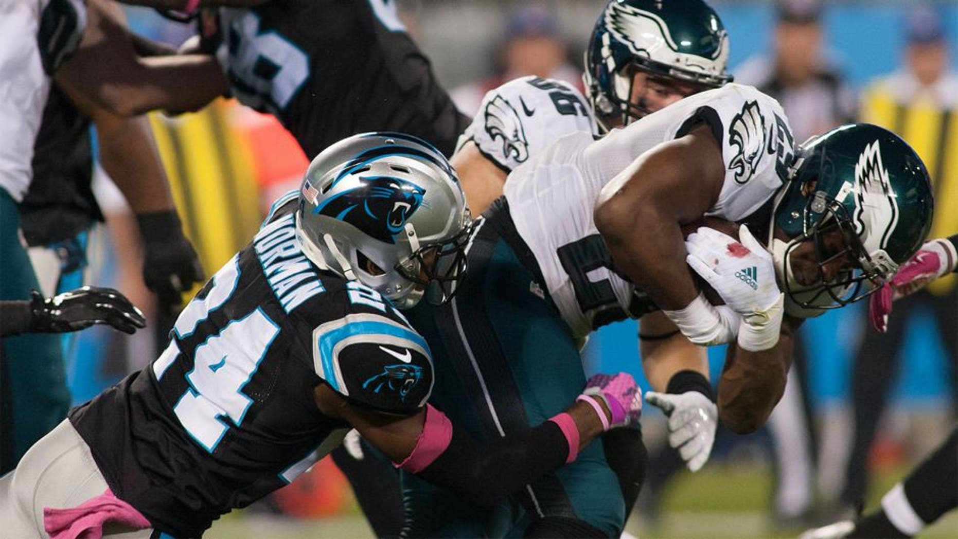 Oct 25, 2015; Charlotte, NC, USA; Philadelphia Eagles running back DeMarco Murray (29) gets tackled by Carolina Panthers cornerback Josh Norman (24) during the first quarter at Bank of America Stadium. Mandatory Credit: Jeremy Brevard-USA TODAY Sports