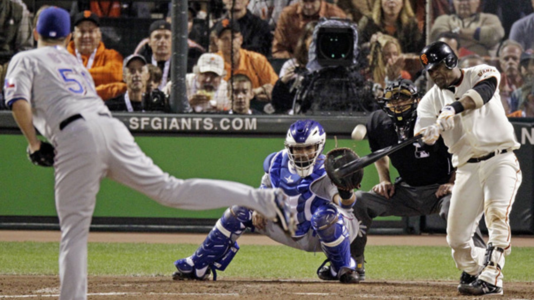 Oct. 27: Giants' Juan Uribe hits a three-run home run during the fifth inning of Game 1 in San Francisco.