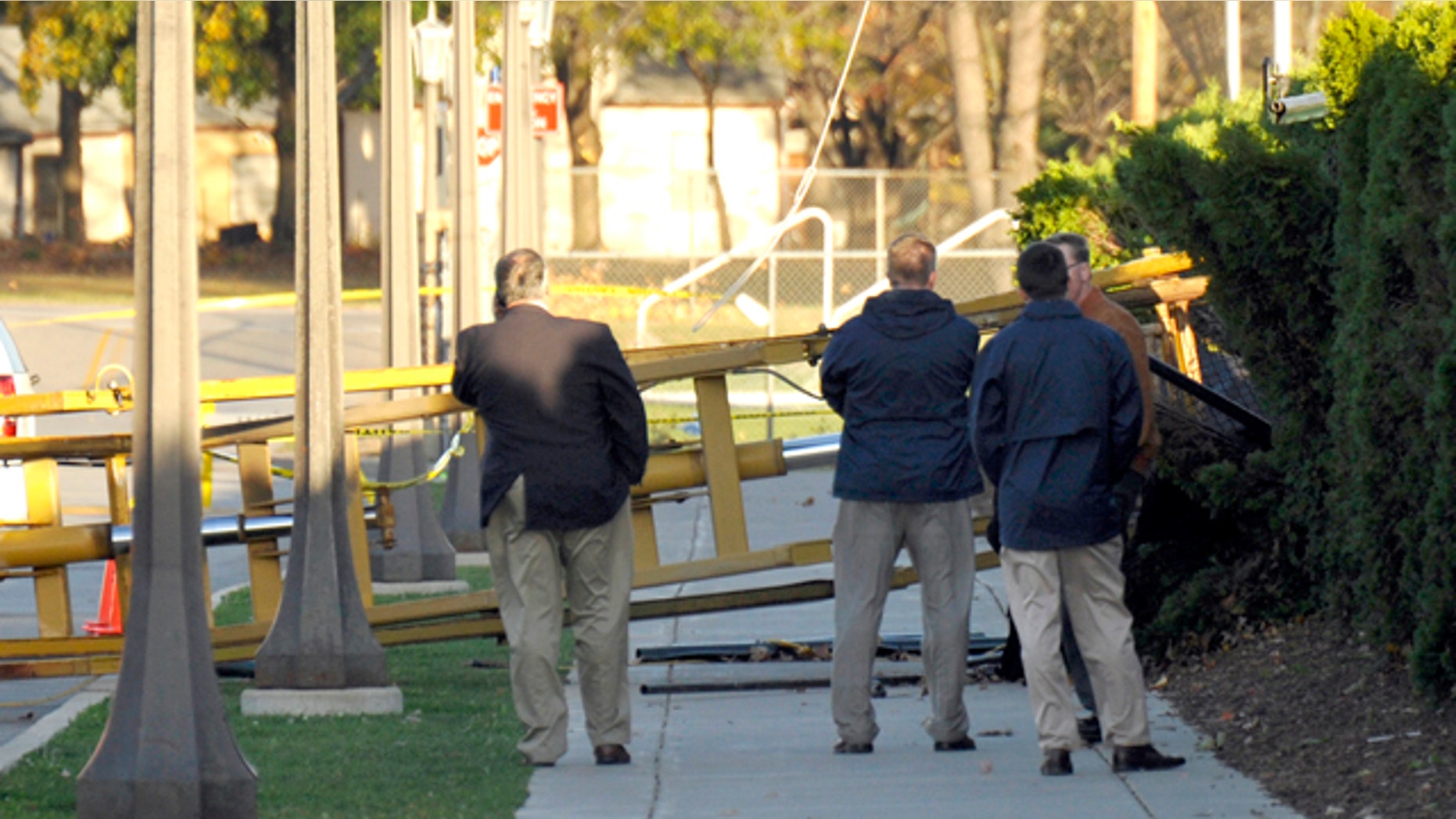 Oct. 27: Notre Dame personnel examine a location where a tower used to video Notre Dame football practice blew over in South Bend, Ind.