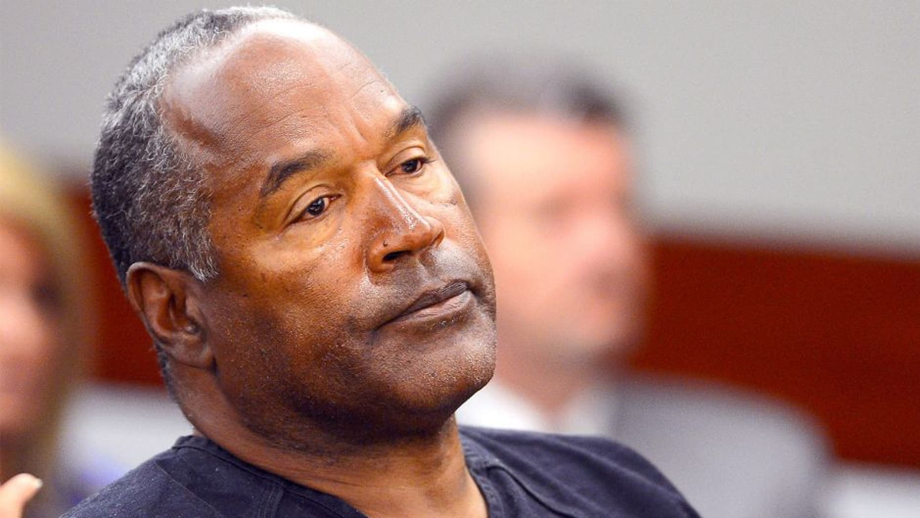 LAS VEGAS, NV - MAY 17: O.J. Simpson watches his former defense attorney Yale Galanter testify during an evidentiary hearing in Clark County District Court on May 17, 2013 in Las Vegas, Nevada. Simpson, who is currently serving a nine-to-33-year sentence in state prison as a result of his October 2008 conviction for armed robbery and kidnapping charges, is using a writ of habeas corpus to seek a new trial, claiming he had such bad representation that his conviction should be reversed. (Photo by Ethan Miller/Getty Images)