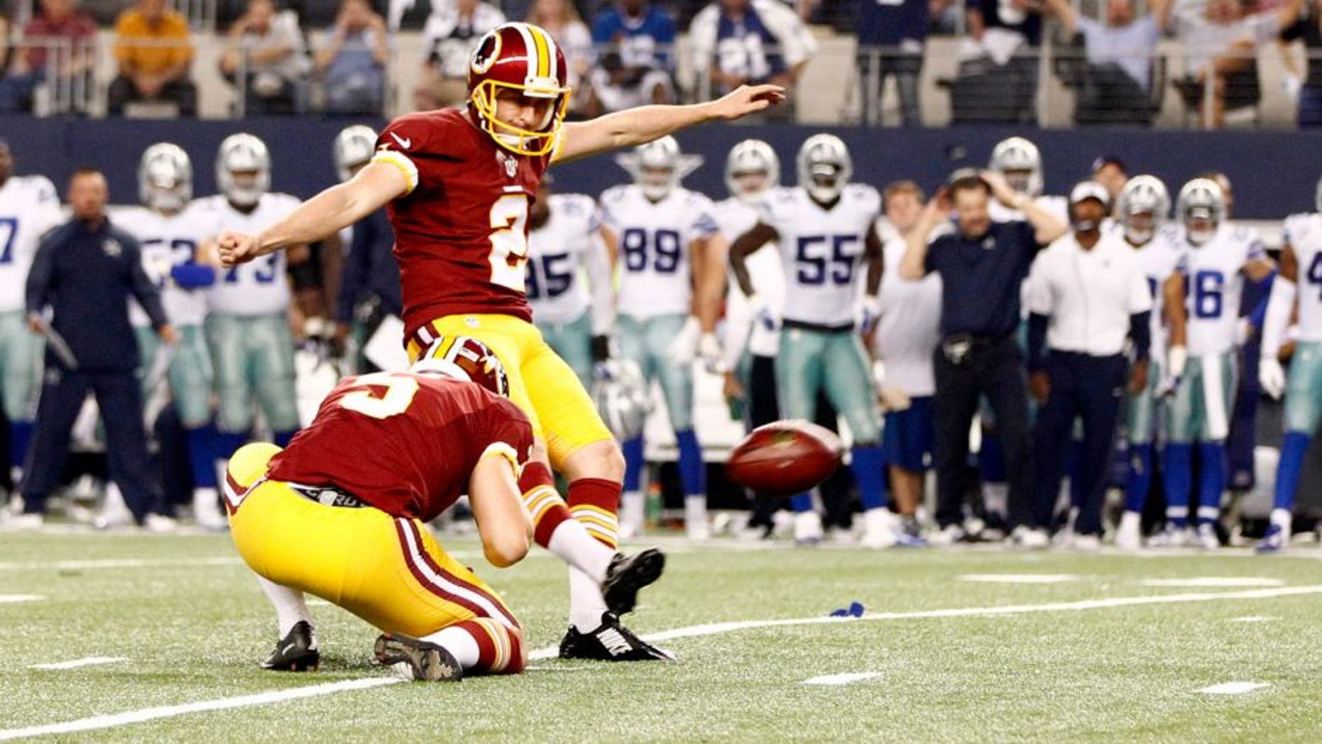 Oct 27, 2014; Arlington, TX, USA; Washington Redskins kicker Kai Forbath (2) kicks a field goal in overtime against the Dallas Cowboys at AT&T Stadium. Washington beat Dallas 20-17 in overtime. Mandatory Credit: Tim Heitman-USA TODAY Sports