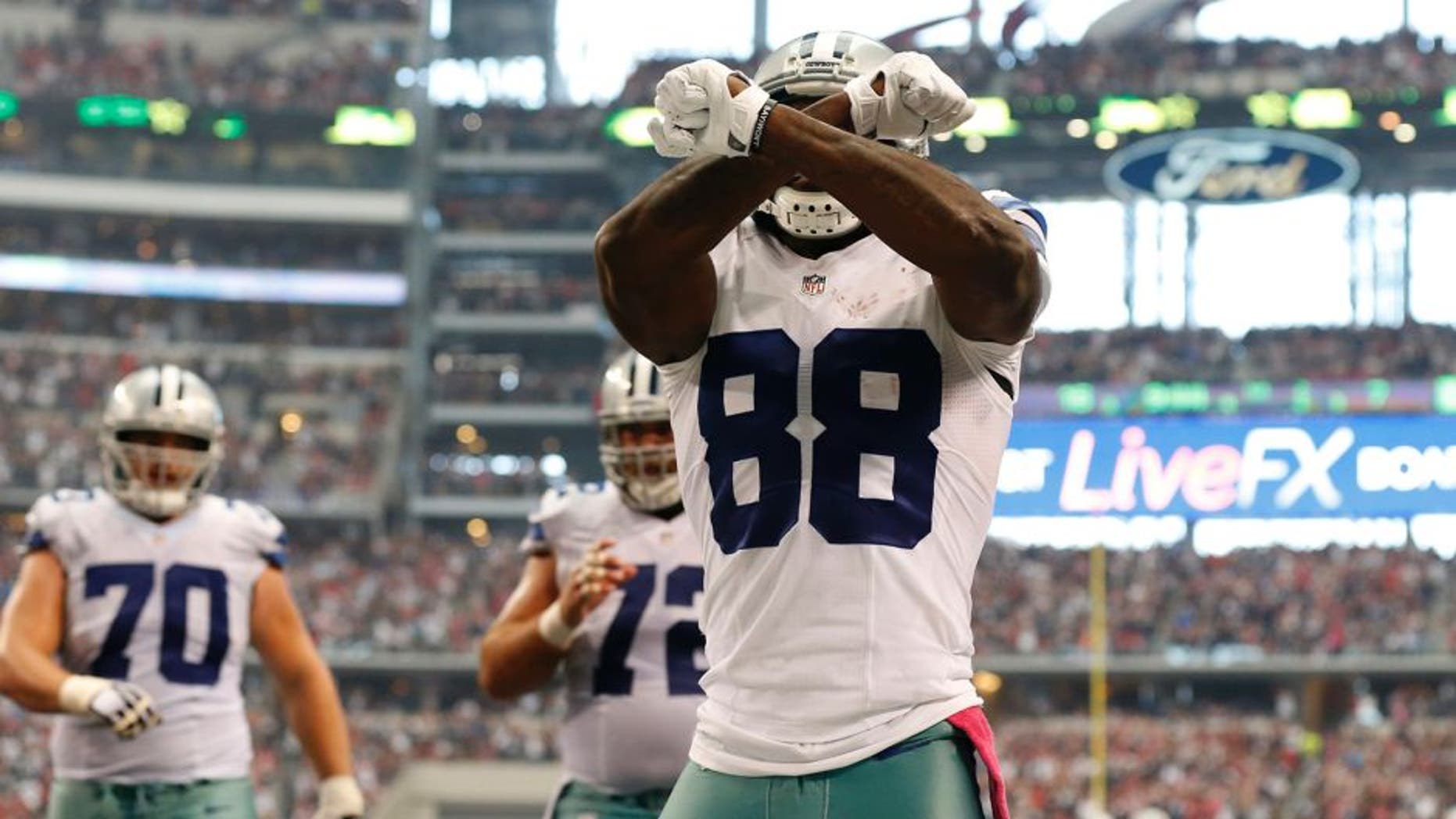Oct 5, 2014; Arlington, TX, USA; Dallas Cowboys receiver Dez Bryant (88) celebrates his fourth quarter touchdown against the Houston Texans at AT&T Stadium. Mandatory Credit: Matthew Emmons-USA TODAY Sports