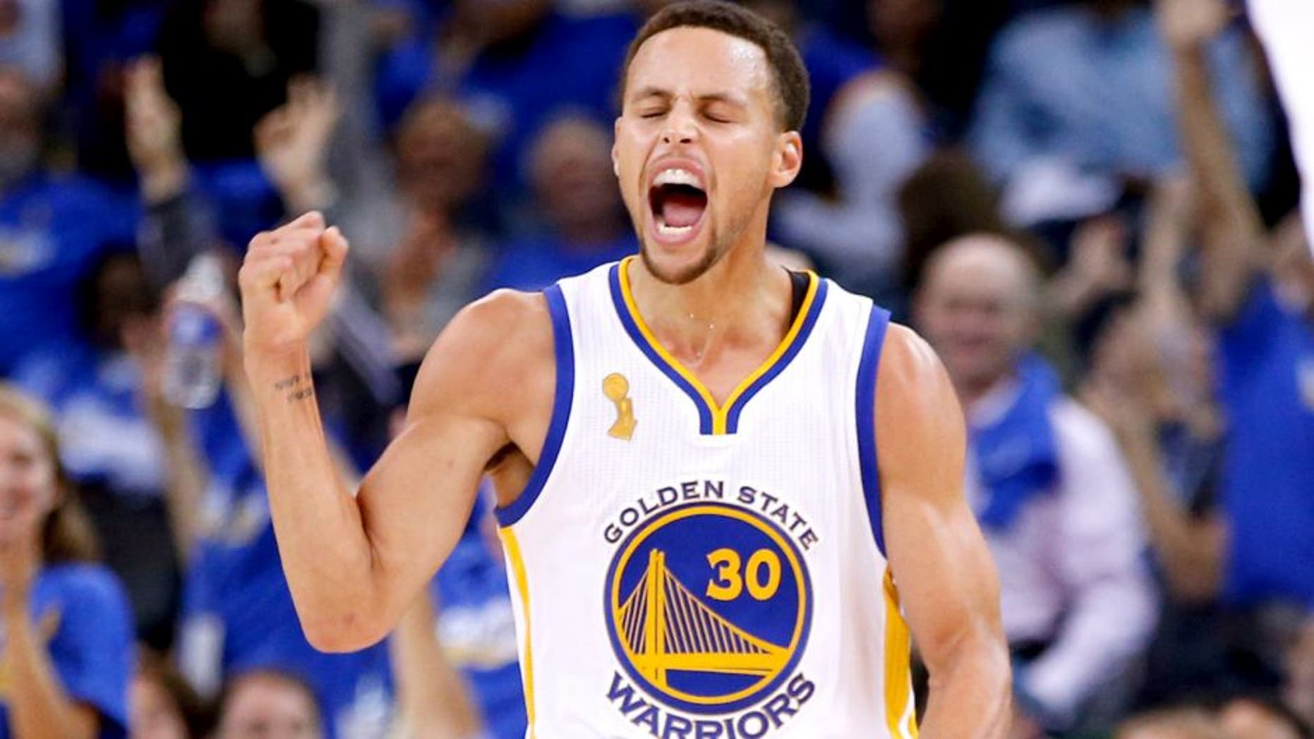 OAKLAND, CA - OCTOBER 27: Stephen Curry #30 of the Golden State Warriors celebrates after a three point basket against the New Orleans Pelicans during the NBA season opener at ORACLE Arena on October 27, 2015 in Oakland, California. NOTE TO USER: User expressly acknowledges and agrees that, by downloading and or using this photograph, User is consenting to the terms and conditions of the Getty Images License Agreement. (Photo by Ezra Shaw/Getty Images)