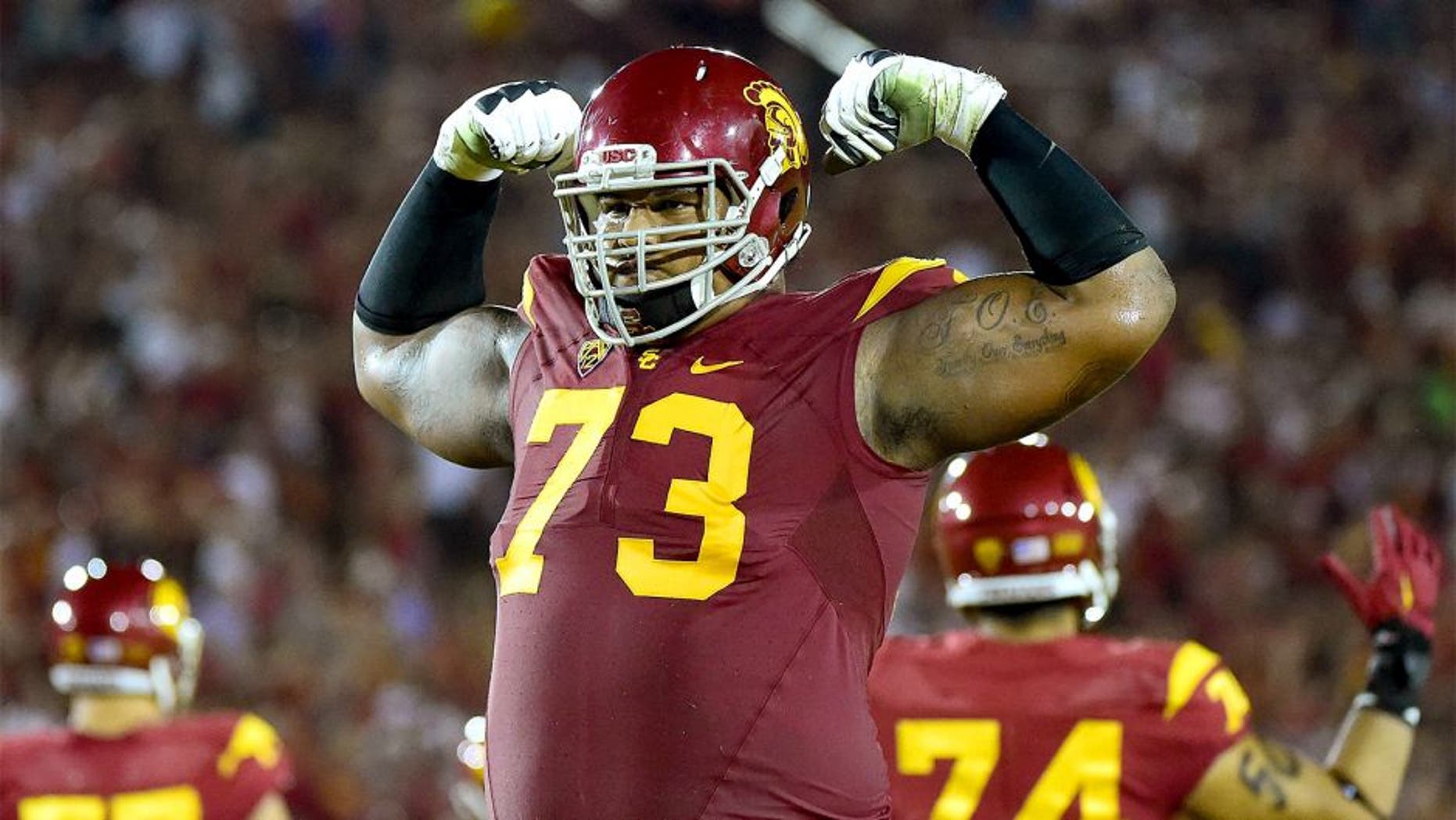 LOS ANGELES, CA - OCTOBER 24: Zach Banner #73 of the USC Trojans celebrates a touchdown to take a 35-17 win over the Utah Utes during the third quarter at Los Angeles Memorial Coliseum on October 24, 2015 in Los Angeles, California. (Photo by Harry How/Getty Images)