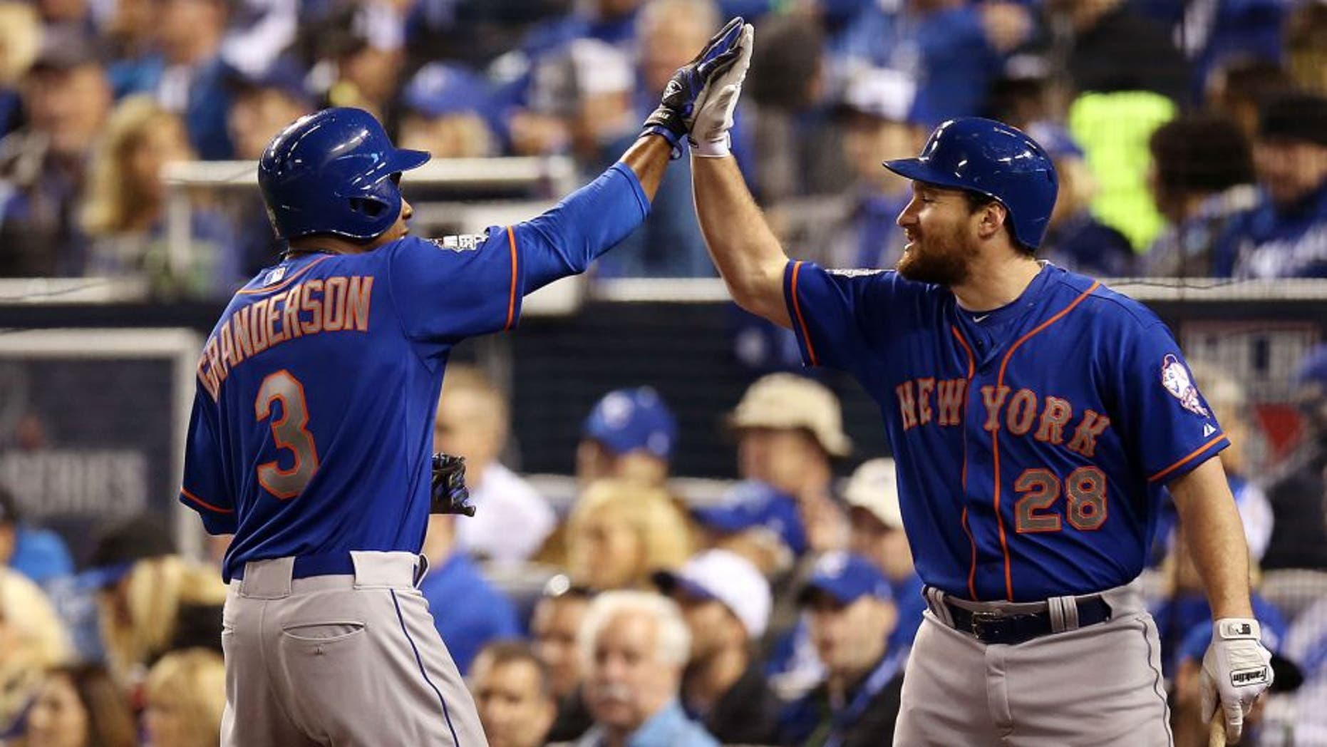 KANSAS CITY, MO - OCTOBER 27: Curtis Granderson #3 of the New York Mets celebrates with Daniel Murphy #28 after hitting a home run in the fifth inning during Game 1 of the 2015 World Series against the Kansas City Royals at Kauffman Stadium on Tuesday, October 27, 2015 in Kansas City, Missouri. (Photo by Brad Mangin/MLB Photos via Getty Images)