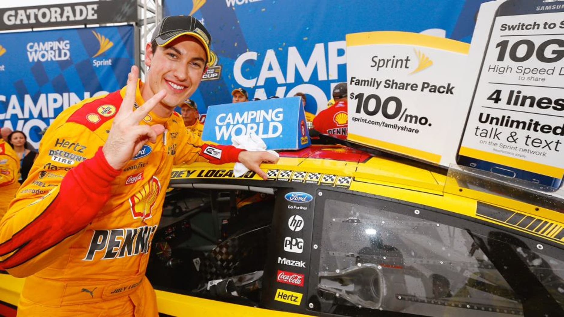 Joey Logano, driver of the #22 Shell Pennzoil Ford, poses with the winner's decal in Victory Lane after winning the NASCAR Sprint Cup Series CampingWorld.com 500 at Talladega Superspeedway on October 25, 2015 in Talladega, Alabama. (Photo by Jonathan Ferrey/NASCAR via Getty Images)