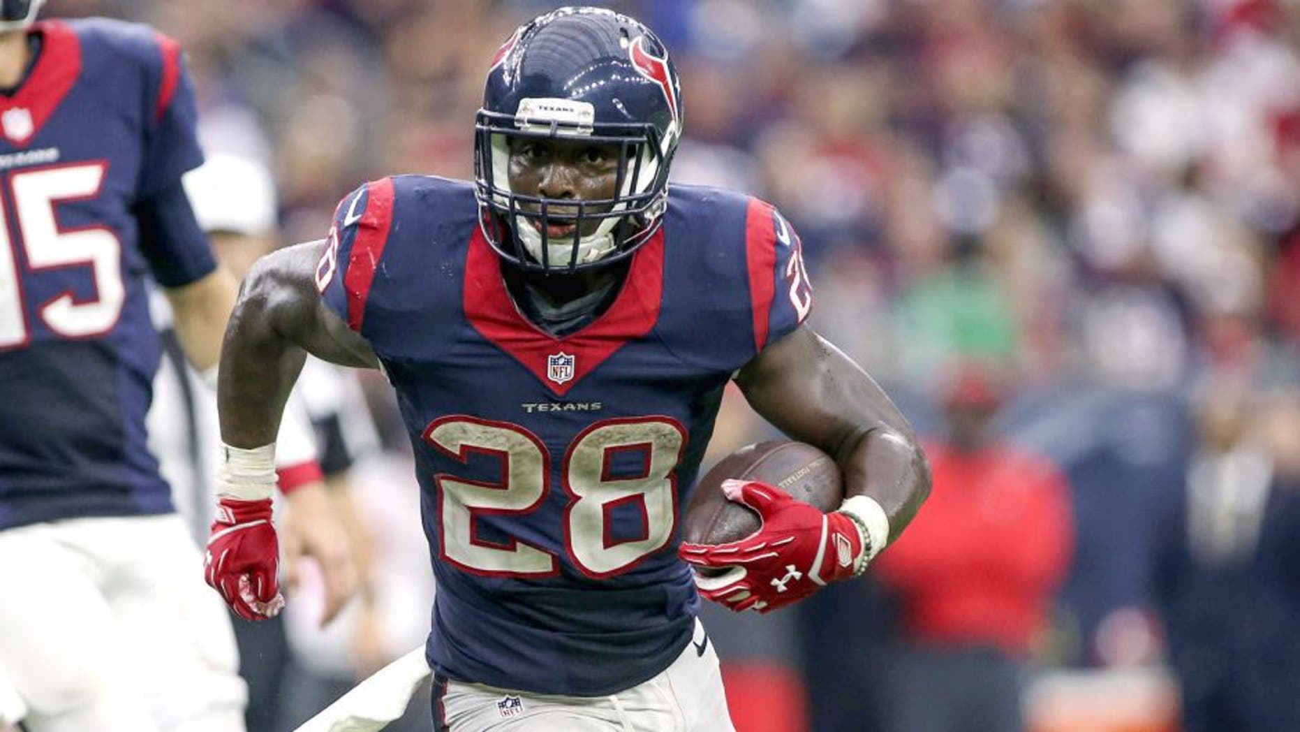 Sep 27, 2015; Houston, TX, USA; Houston Texans running back Alfred Blue (28) rushes during the fourth quarter against the Tampa Bay Buccaneers at NRG Stadium. The Texans defeated the Buccaneers 19-9. Mandatory Credit: Troy Taormina-USA TODAY Sports