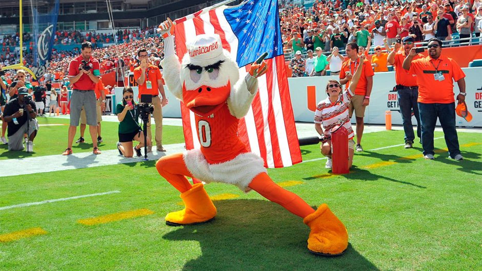 Sep 19, 2015; Miami Gardens, FL, USA; Miami Hurricanes mascot Sebastian carries the American flag before a game against Nebraska Cornhuskers at Sun Life Stadium. Miami won 36-33. Mandatory Credit: Steve Mitchell-USA TODAY Sports