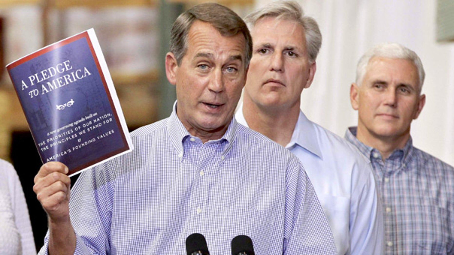 FILE: House Minority Leader John Boehner holds a copy of the GOP agenda, "A Pledge to America," in Sterling, Va., on Sept. 23.