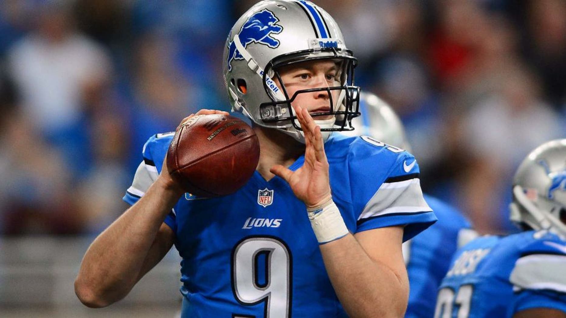Oct 27, 2013; Detroit, MI, USA; Detroit Lions quarterback Matthew Stafford (9) looks to pass during the second quarter against the Dallas Cowboys at Ford Field. Mandatory Credit: Andrew Weber-USA TODAY Sports