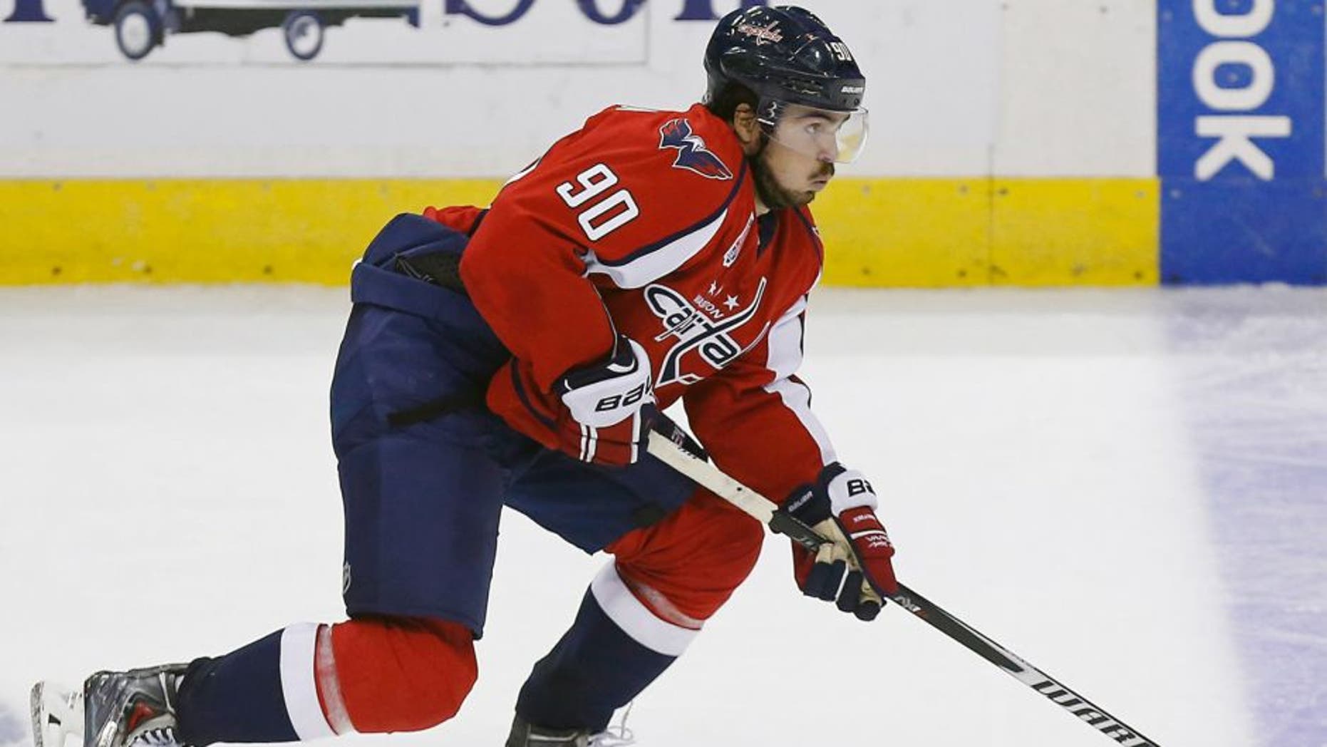 Oct 14, 2014; Washington, DC, USA; Washington Capitals left wing Marcus Johansson (90) skates with the puck against the San Jose Sharks at Verizon Center. Mandatory Credit: Geoff Burke-USA TODAY Sports