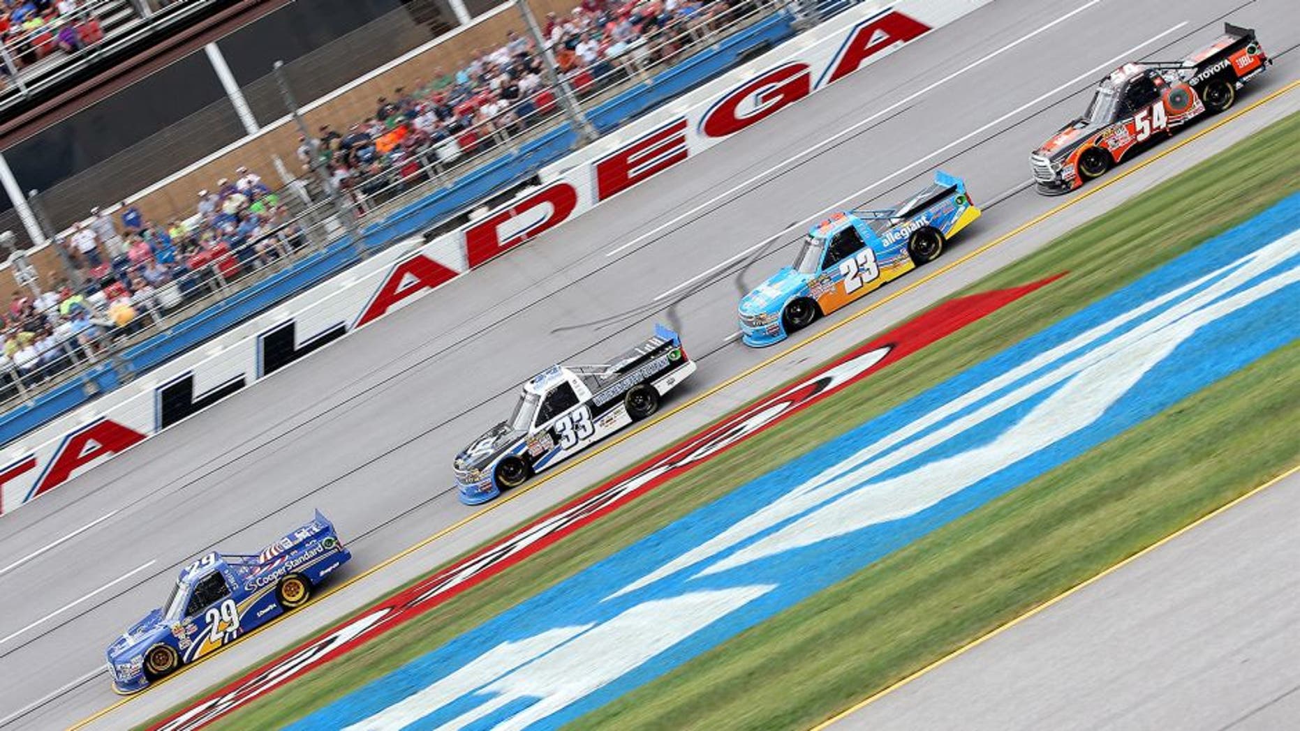 TALLADEGA, AL - OCTOBER 24: Brian Keselowski, driver of the #29 Cooper Standard Ford, leads a pack of trucks during the NASCAR Camping World Truck Series fred's 250 at Talladega Superspeedway on October 24, 2015 in Talladega, Alabama. (Photo by Sean Gardner/NASCAR via Getty Images)