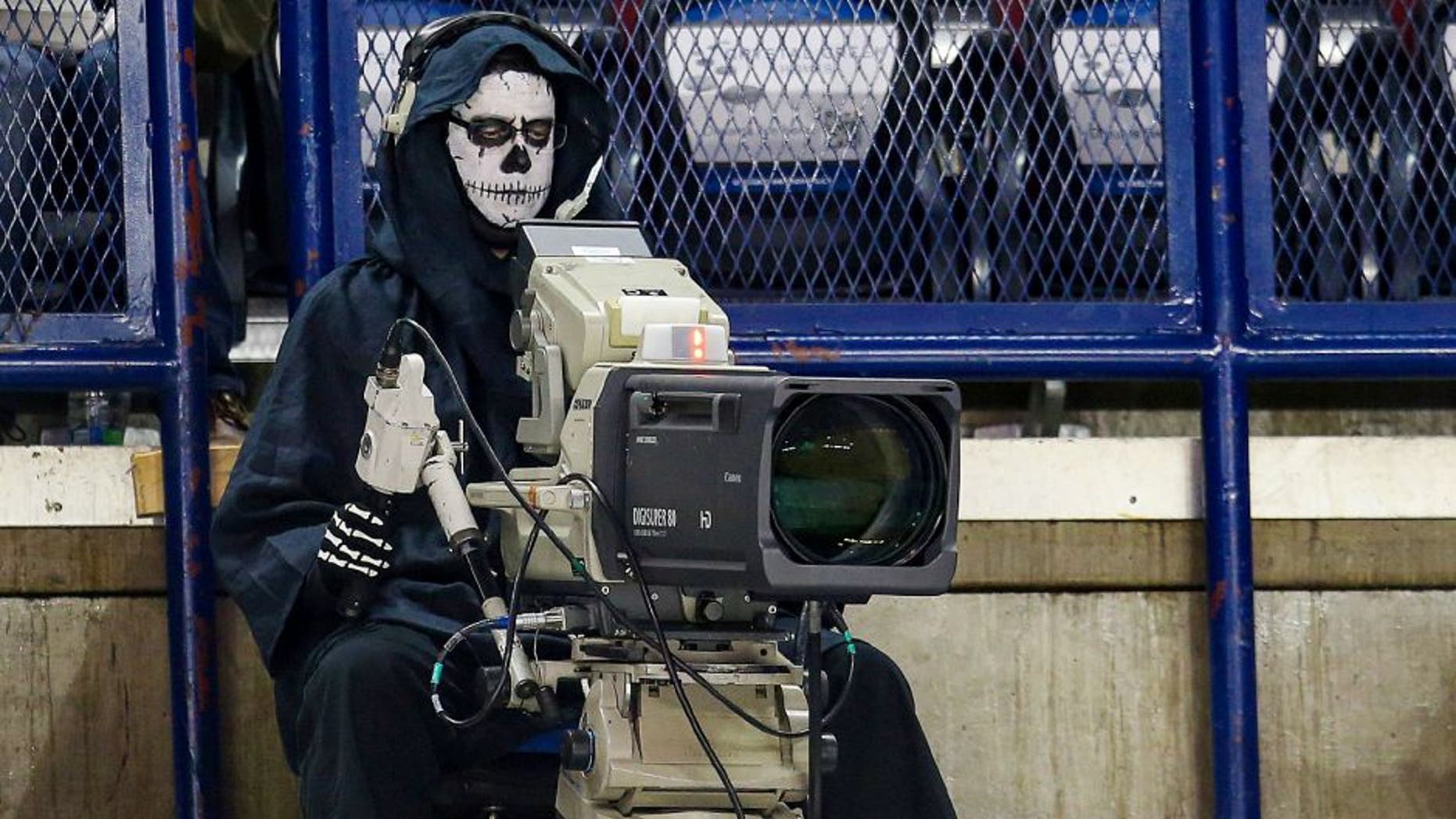 Oct 31, 2014; Calgary, Alberta, CAN; Camera man dressed up for Halloween prior to the game between the Calgary Flames and the Nashville Predators at Scotiabank Saddledome. Calgary Flames won 4-3. Mandatory Credit: Sergei Belski-USA TODAY Sports