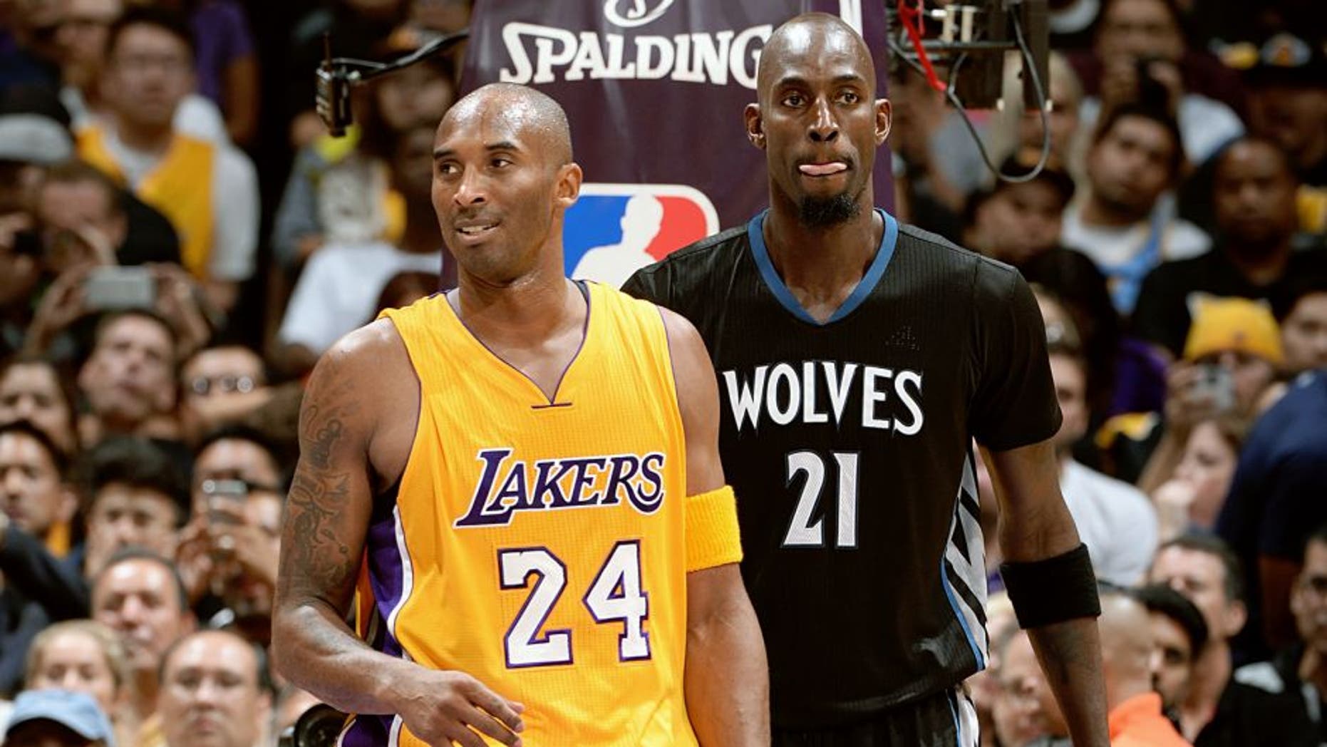 LOS ANGELES, CA - OCTOBER 28: Kobe Bryant #24 of the Los Angeles Lakers and Kevin Garnett #21 of the Minnesota Timberwolves stand on the court on October 28, 2015 at STAPLES Center in Los Angeles, California. NOTE TO USER: User expressly acknowledges and agrees that, by downloading and/or using this Photograph, user is consenting to the terms and conditions of the Getty Images License Agreement. Mandatory Copyright Notice: Copyright 2015 NBAE (Photo by Andrew D. Bernstein/NBAE via Getty Images)