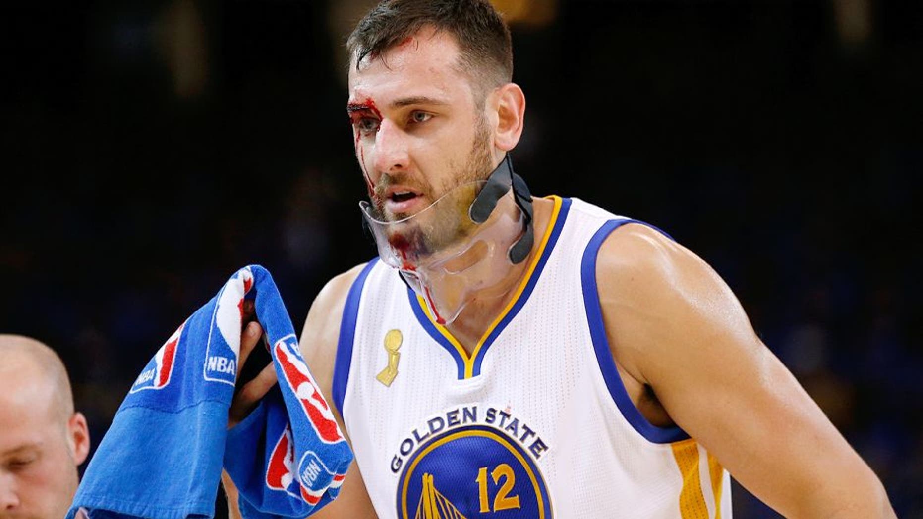 OAKLAND, CA - OCTOBER 27: Andrew Bogut #12 of the Golden State Warriors walks off the court after being cut during the NBA season opener against the New Orleans Pelicans at ORACLE Arena on October 27, 2015 in Oakland, California. NOTE TO USER: User expressly acknowledges and agrees that, by downloading and or using this photograph, User is consenting to the terms and conditions of the Getty Images License Agreement. (Photo by Ezra Shaw/Getty Images)