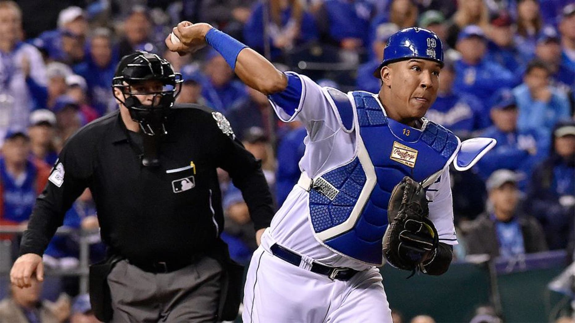 Kansas City Royals catcher Salvador Perez throws to first to retire the New York Mets' Daniel Murphy on a third-strike wild pitch in the 12th inning in Game 1 of the World Series on Tuesday, Oct. 27, 2015, at Kauffman Stadium in Kansas City, Mo. (John Sleezer/Kansas City Star/TNS via Getty Images)