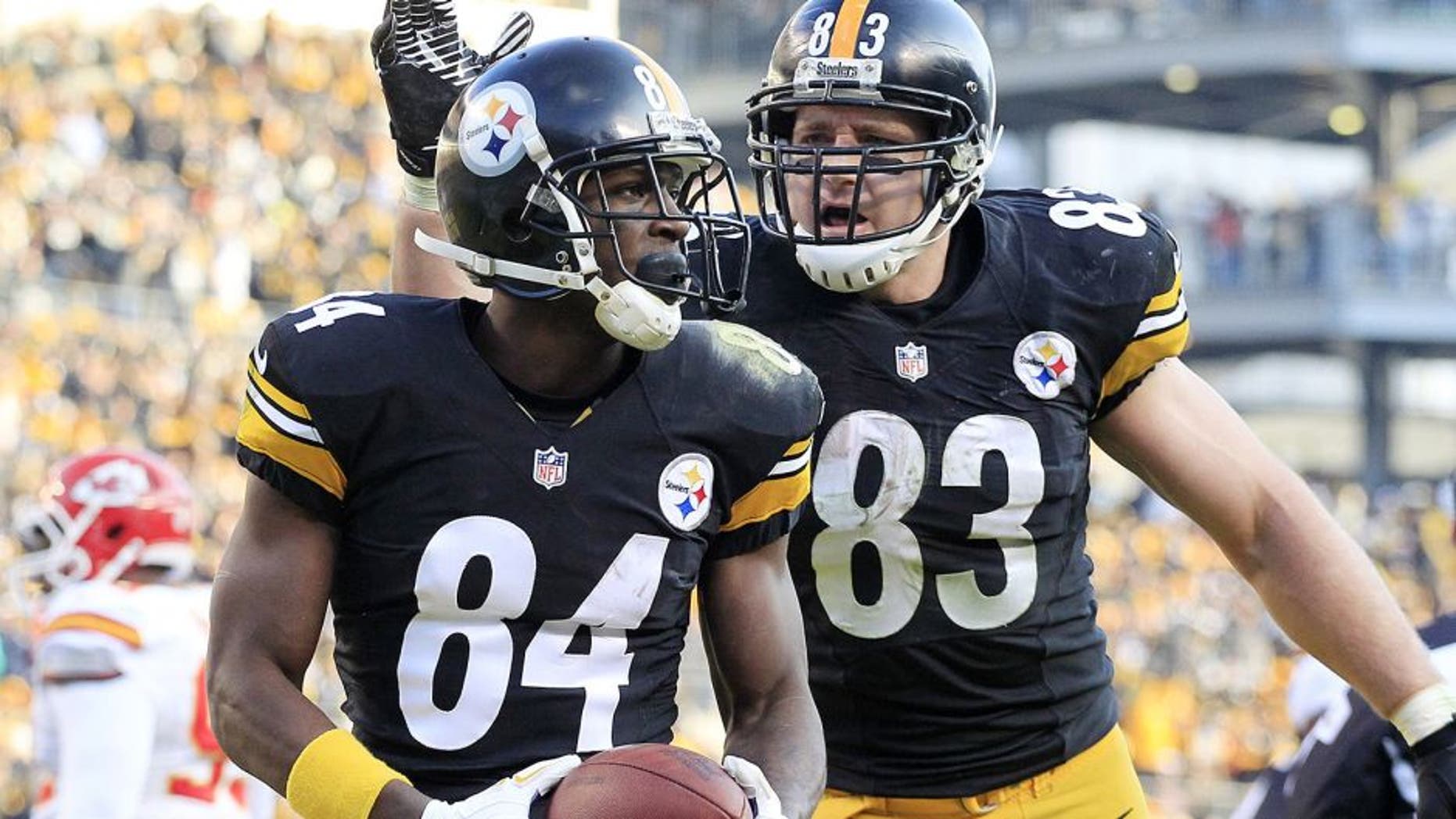 Dec 21, 2014; Pittsburgh, PA, USA; Pittsburgh Steelers wide receiver Antonio Brown (84) and tight end Heath Miller (83) celebrate after Brown scored a touchdown against the Kansas City Chiefs during the third quarter at Heinz Field. The Steelers won 20-12. Mandatory Credit: Charles LeClaire-USA TODAY Sports