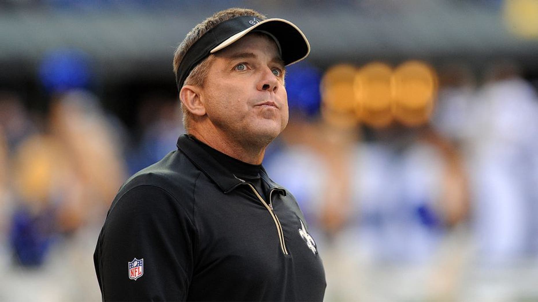 Oct 25, 2015; Indianapolis, IN, USA; New Orleans Saints head coach Sean Payton looks at the scoreboard during the final minutes of their game against the Indianapolis Colts at Lucas Oil Stadium. The Saints went on to win the game, 27-21. Mandatory Credit: Thomas J. Russo-USA TODAY Sports