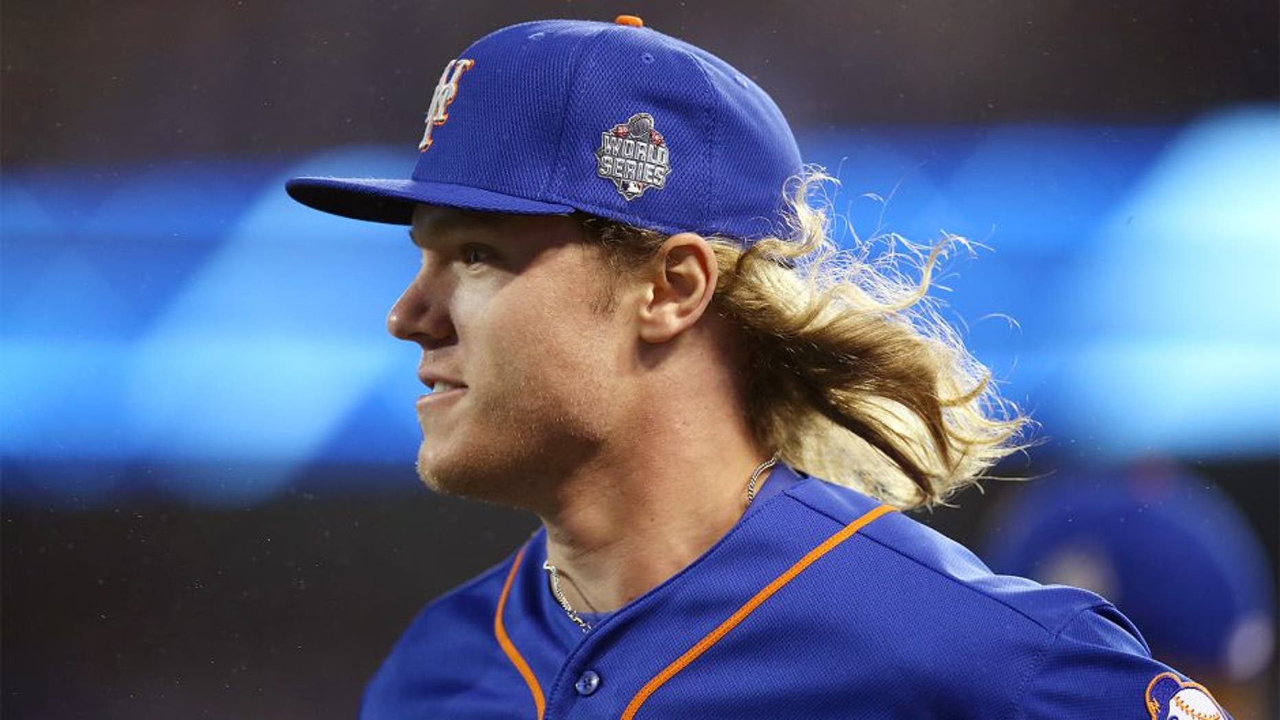 KANSAS CITY, MO - OCTOBER 27: Noah Syndergaard #34 of the New York Mets walks on the field during Game 1 of the 2015 World Series against the Kansas City Royals at Kauffman Stadium on Tuesday, October 27, 2015 in Kansas City, Missouri. (Photo by Brad Mangin/MLB Photos via Getty Images)