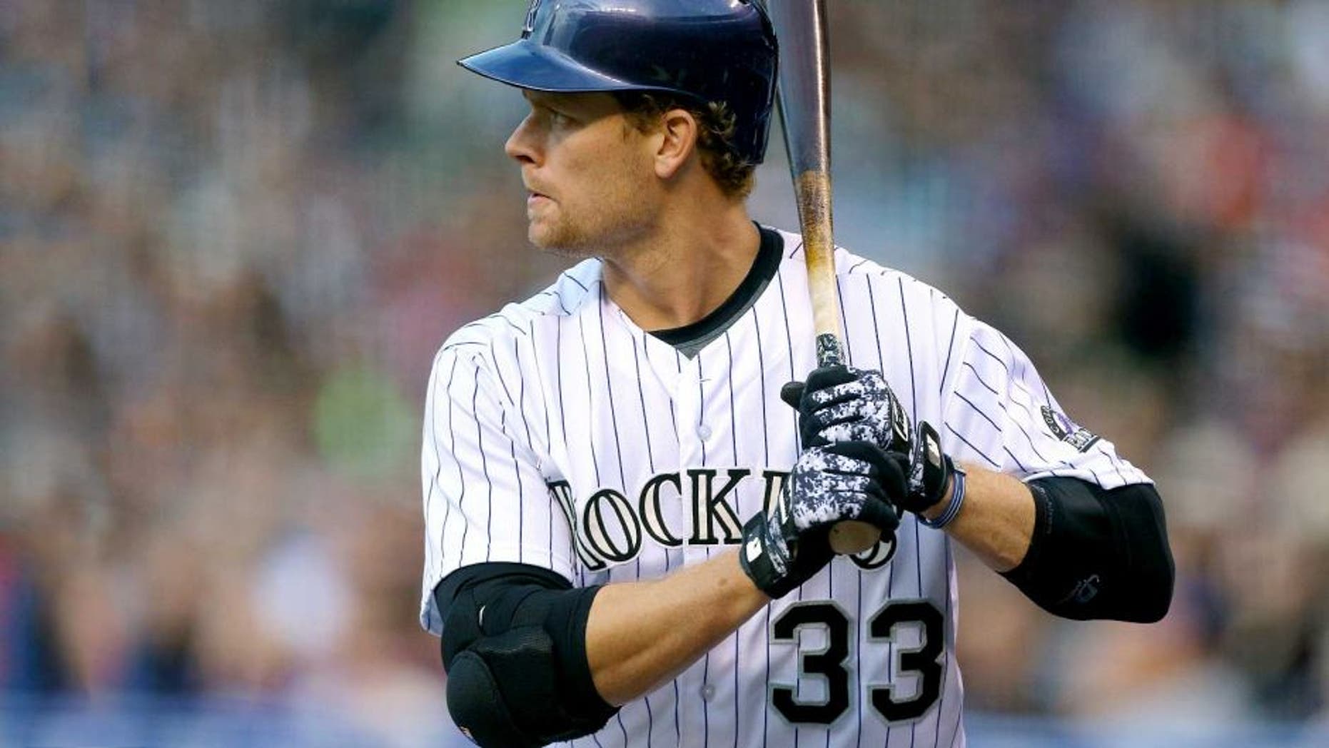 DENVER, CO - APRIL 25: Justin Morneau #33 of the Colorado Rockies bats against the San Francisco Giants at Coors Field on April 25, 2015 in Denver, Colorado. (Photo by Justin Edmonds/Getty Images)