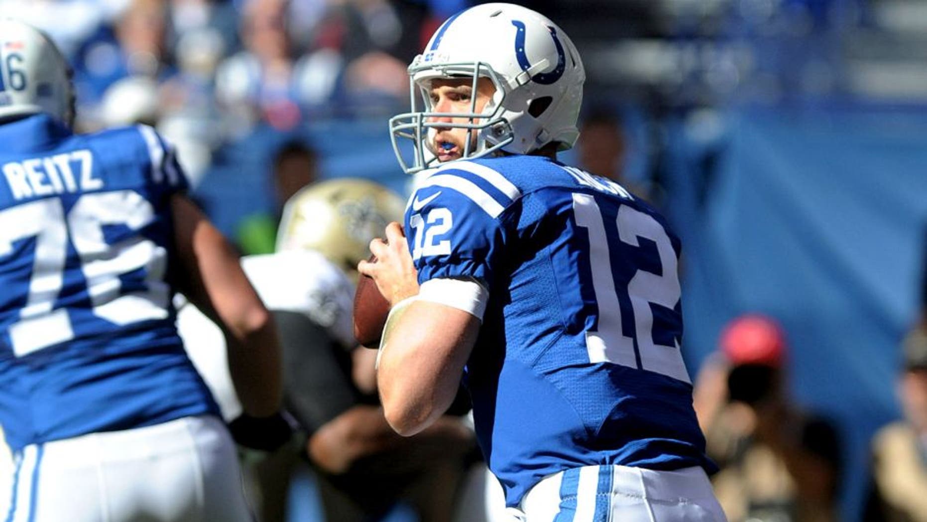 Oct 25, 2015; Indianapolis, IN, USA; Indianapolis Colts quarterback Andrew Luck (12) drops back to pass against the New Orleans Saints in the first quarter at Lucas Oil Stadium. Mandatory Credit: Thomas J. Russo-USA TODAY Sports