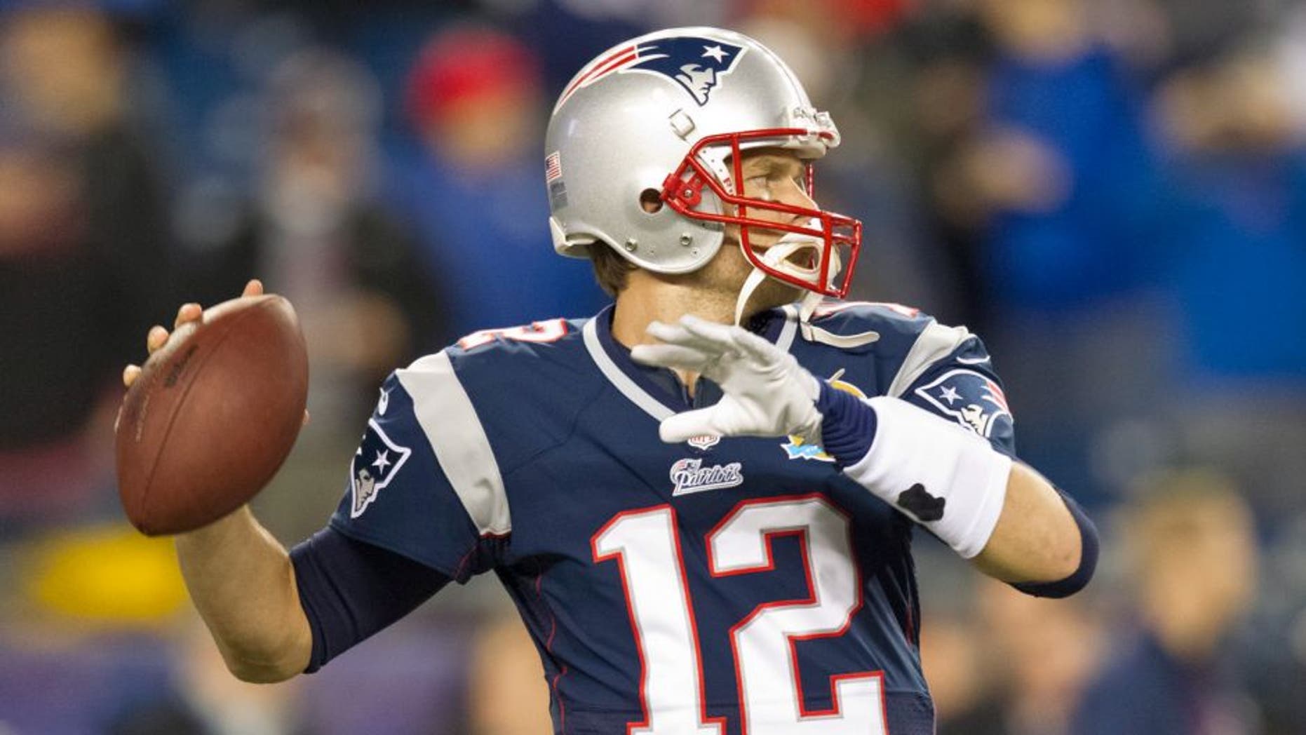 New England Patriots quarterback Tom Brady throws a pass during warm up before they play the Houston Texans in an NFL Monday Night Football game at Gillette Stadium on Monday, Dec. 10, 2012. (Photo by Matthew J. Lee/The Boston Globe via Getty Images)