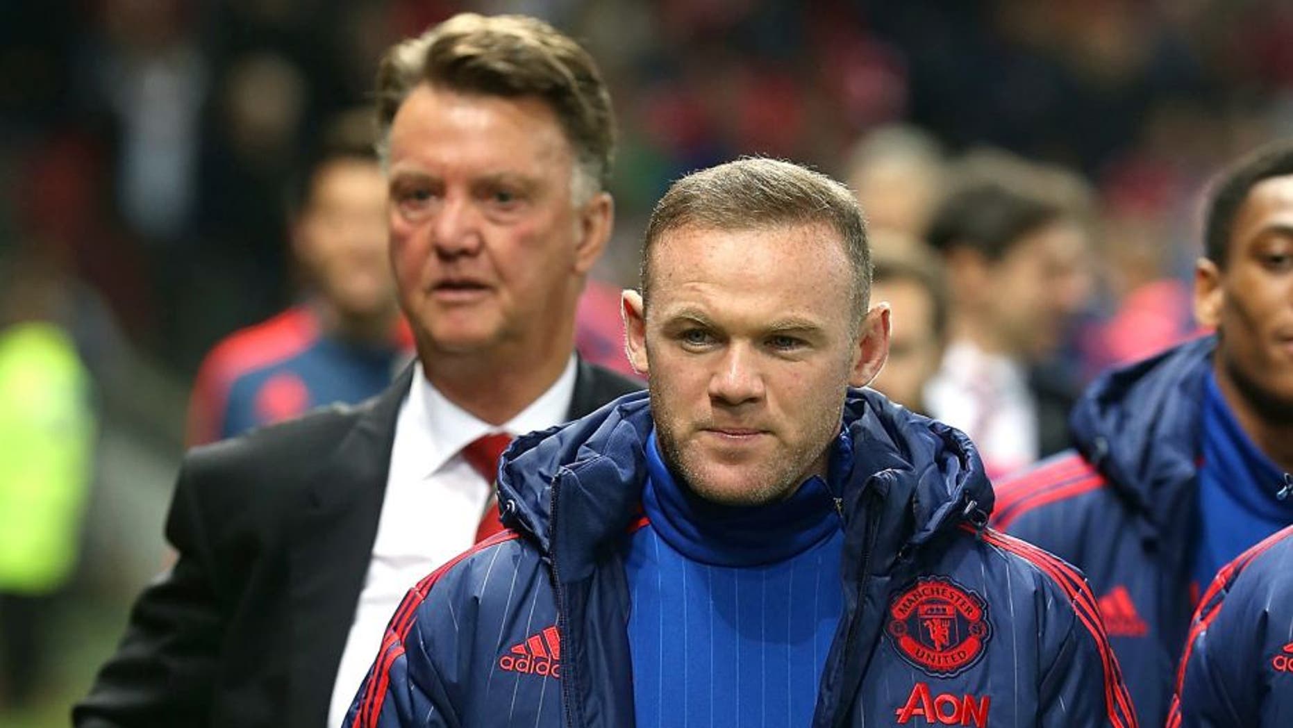 MANCHESTER, ENGLAND - OCTOBER 28: Manager Louis van Gaal and Wayne Rooney of Manchester United walk to the bench ahead of the Capital One Fourth Round match between Manchester United and Middlesbrough at Old Trafford on October 28, 2015 in Manchester, England. (Photo by Matthew Peters/Man Utd via Getty Images)