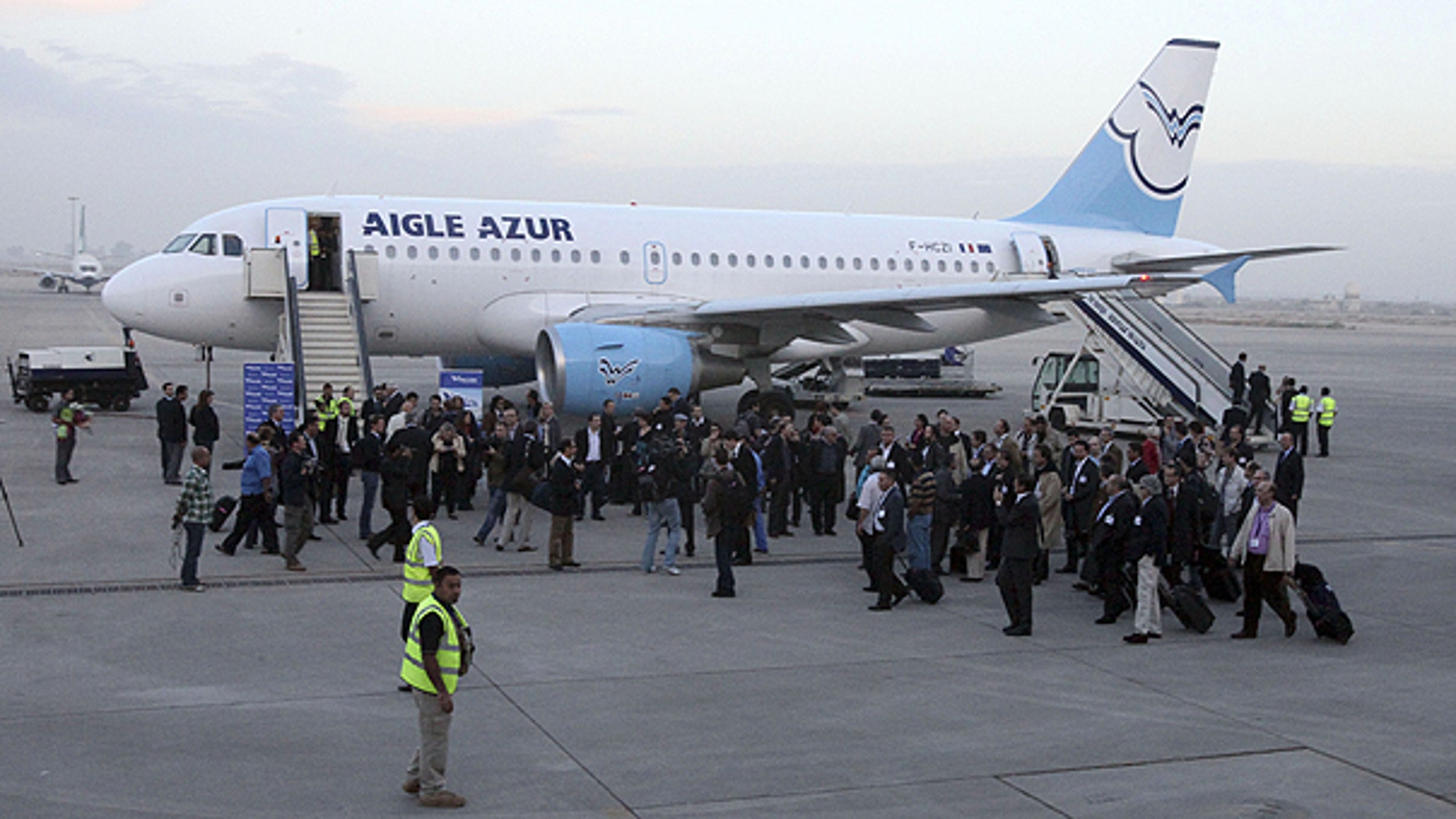 Oct. 31: A group of French business leaders leaves the Aigle Azur plane after arriving in Baghdad, Iraq.