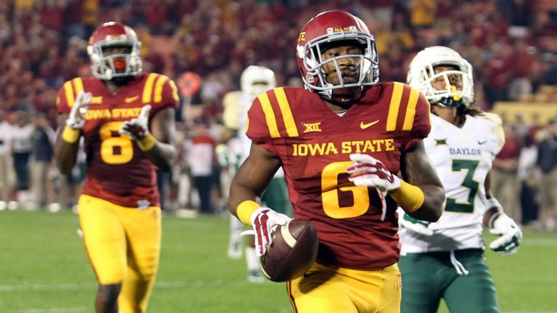 Sep 27, 2014; Ames, IA, USA; Iowa State Cyclones wide receiver D'Vario Montgomery (8) scores a late touchdown against the Baylor Bears at Jack Trice Stadium. Baylor beat the Cyclones 49-28. Mandatory Credit: Reese Strickland-USA TODAY Sports