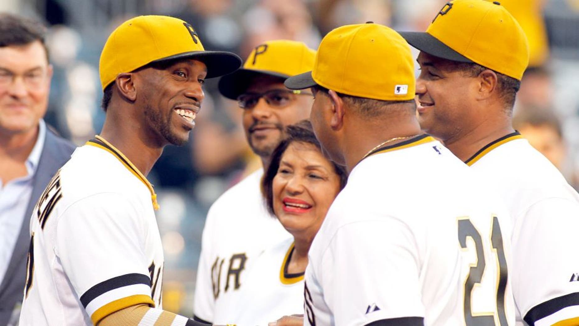 PITTSBURGH, PA - SEPTEMBER 16: Andrew McCutchen #22 of the Pittsburgh Pirates shakes the hands of the Clemente family before the game on Roberto Clemente Day at PNC Park on September 16, 2015 in Pittsburgh, Pennsylvania. (Photo by Justin K. Aller/Getty Images)