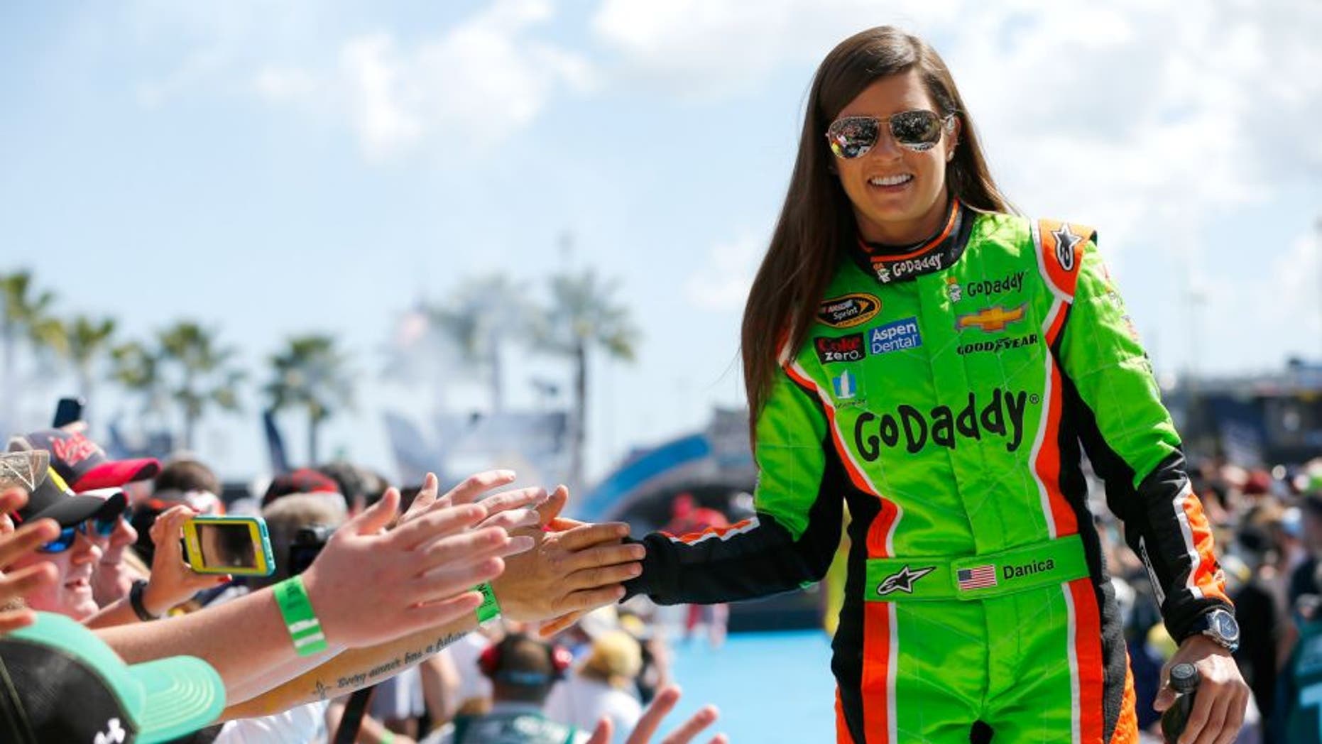 Danica Patrick, driver of the #10 GoDaddy Chevrolet, greets fans during the NASCAR Sprint Cup Series 57th Annual Daytona 500 at Daytona International Speedway on February 22, 2015 in Daytona Beach, Florida.