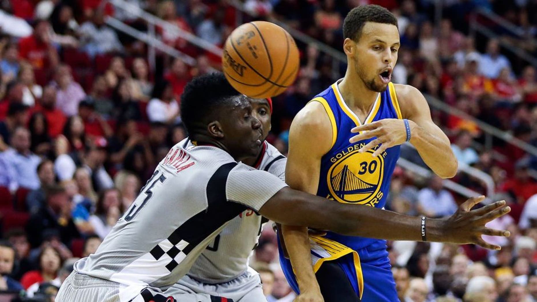 Oct 30, 2015; Houston, TX, USA; Golden State Warriors guard Stephen Curry (30) passes the ball during the second quarter against the Houston Rockets at Toyota Center. Mandatory Credit: Troy Taormina-USA TODAY Sports