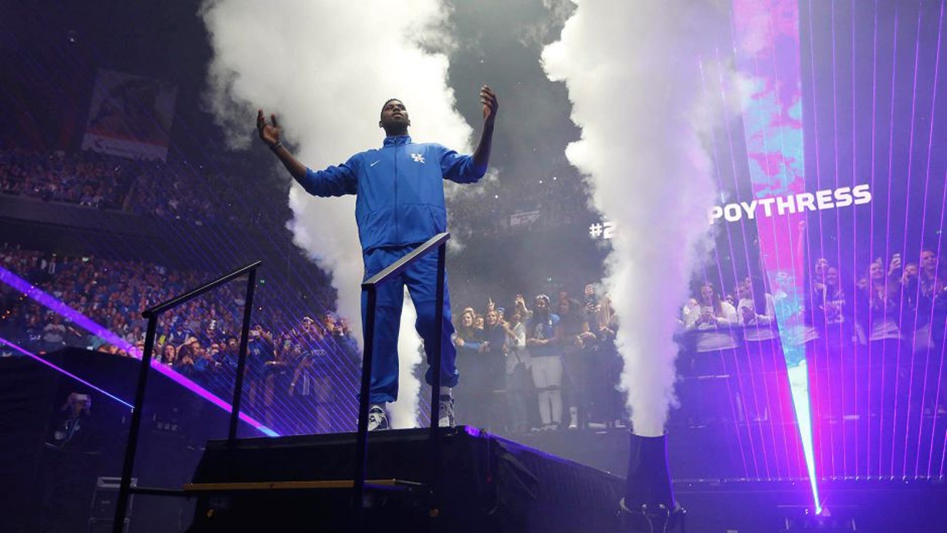 Oct 16, 2015; Lexington, KY, USA; Kentucky Wildcats forward Alex Poythress (22) waves to the crowd during player introduced prior to the Kentucky Blue Madness at Rupp Arena. Mandatory Credit: Mark Zerof-USA TODAY Sports