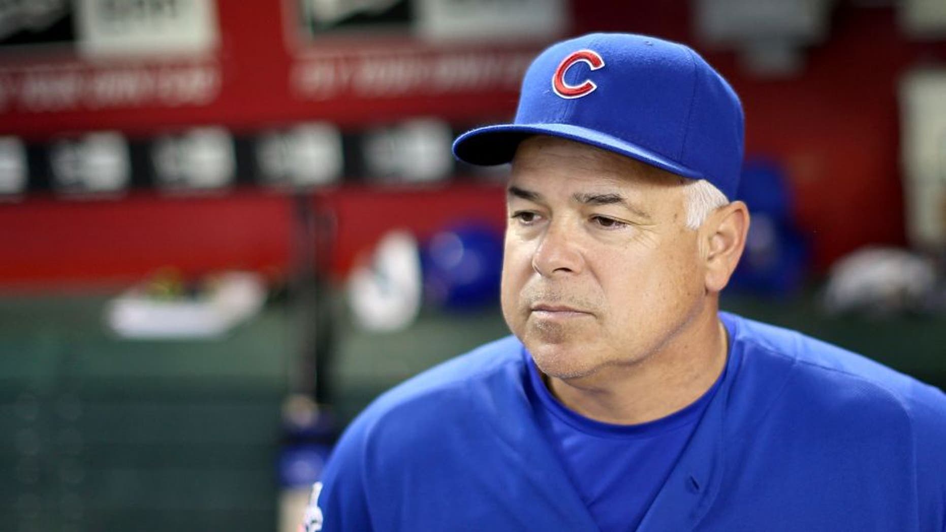 PHOENIX, AZ - JULY 18: Manager Rick Renteria #16 of the Chicago Cubs watches from the dugout during the MLB game against the Arizona Diamondbacks at Chase Field on July 18, 2014 in Phoenix, Arizona. (Photo by Christian Petersen/Getty Images) *** Local Caption *** Rick Renteria