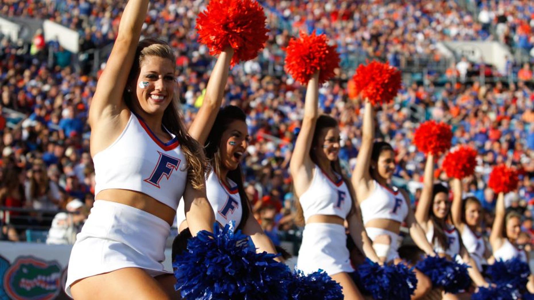 Nov 2, 2013; Jacksonville, FL, USA; Florida Gators cheerleaders cheer against the Georgia Bulldogs during the second quarter at EverBank Field. Mandatory Credit: Kim Klement-USA TODAY Sports