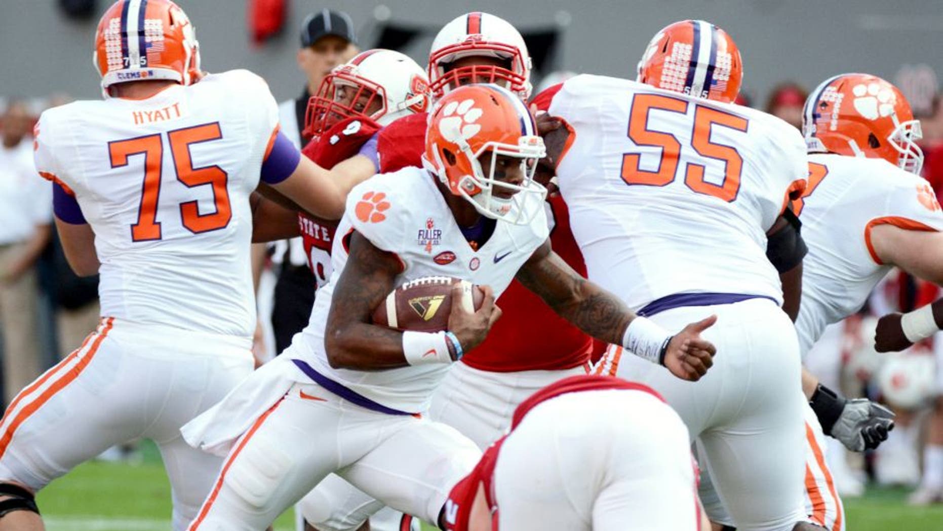 Oct 31, 2015; Raleigh, NC, USA; Clemson Tigers quarterback Deshaun Watson (4) runs the ball during the first half against the North Carolina State Wolfpack at Carter Finley Stadium. Mandatory Credit: Rob Kinnan-USA TODAY Sports