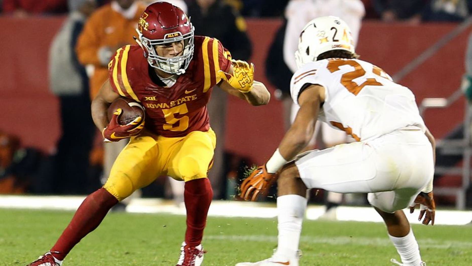 Oct 31, 2015; Ames, IA, USA; Iowa State Cyclones wide receiver Allen Lazard (5) runs with the football against Texas Longhorns cornerback John Bonney (24) during the second quarter at Jack Trice Stadium. Mandatory Credit: Reese Strickland-USA TODAY Sports