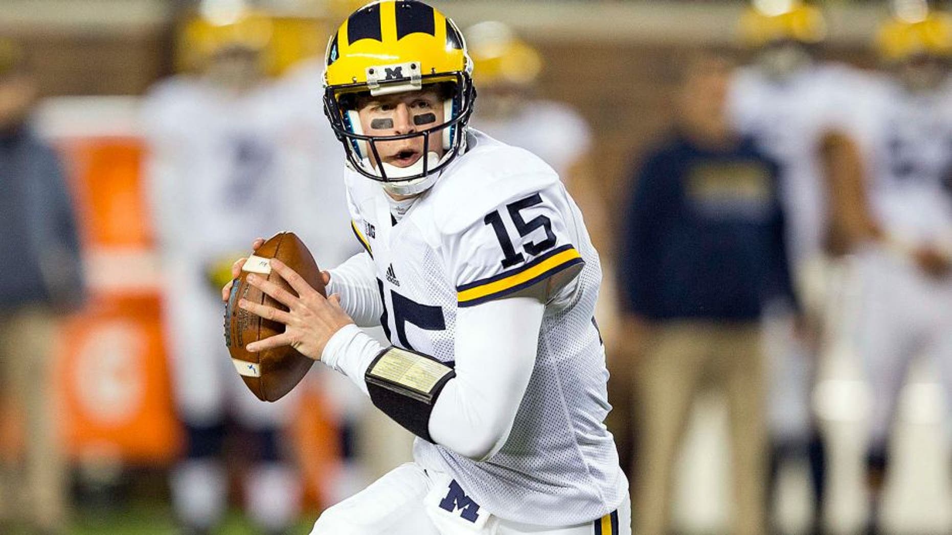 Oct 31, 2015; Minneapolis, MN, USA; Michigan Wolverines quarterback Jake Rudock (15) drops back for a pass in the first quarter against the Minnesota Golden Gophers at TCF Bank Stadium. Mandatory Credit: Jesse Johnson-USA TODAY Sports