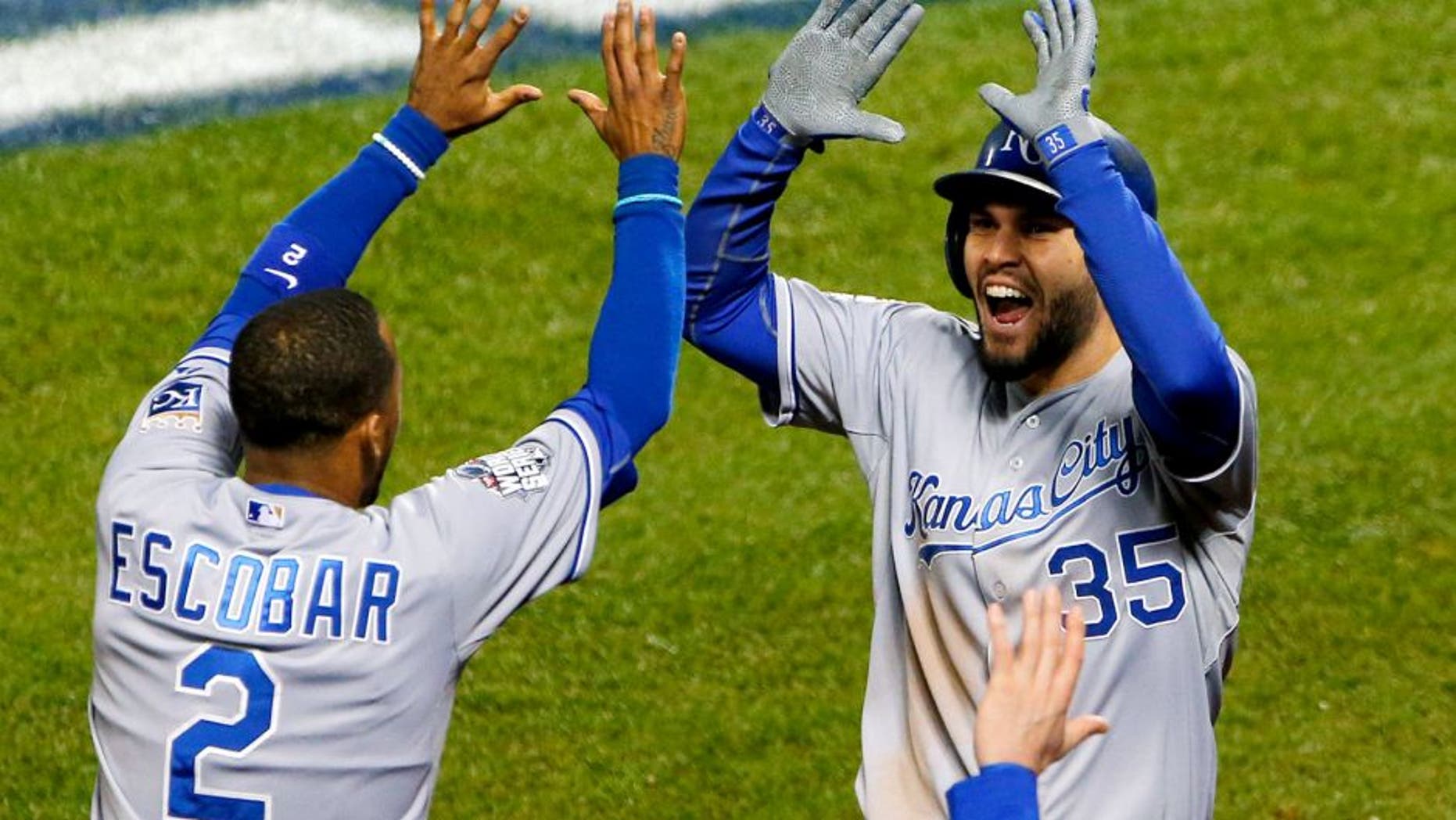 Oct 31, 2015; New York City, NY, USA; Kansas City Royals first baseman Eric Hosmer (35) celebrates with shortstop Alcides Escobar (2) after scoring a run against the New York Mets in the 8th inning in game four of the World Series at Citi Field. Mandatory Credit: Noah K. Murray-USA TODAY Sports