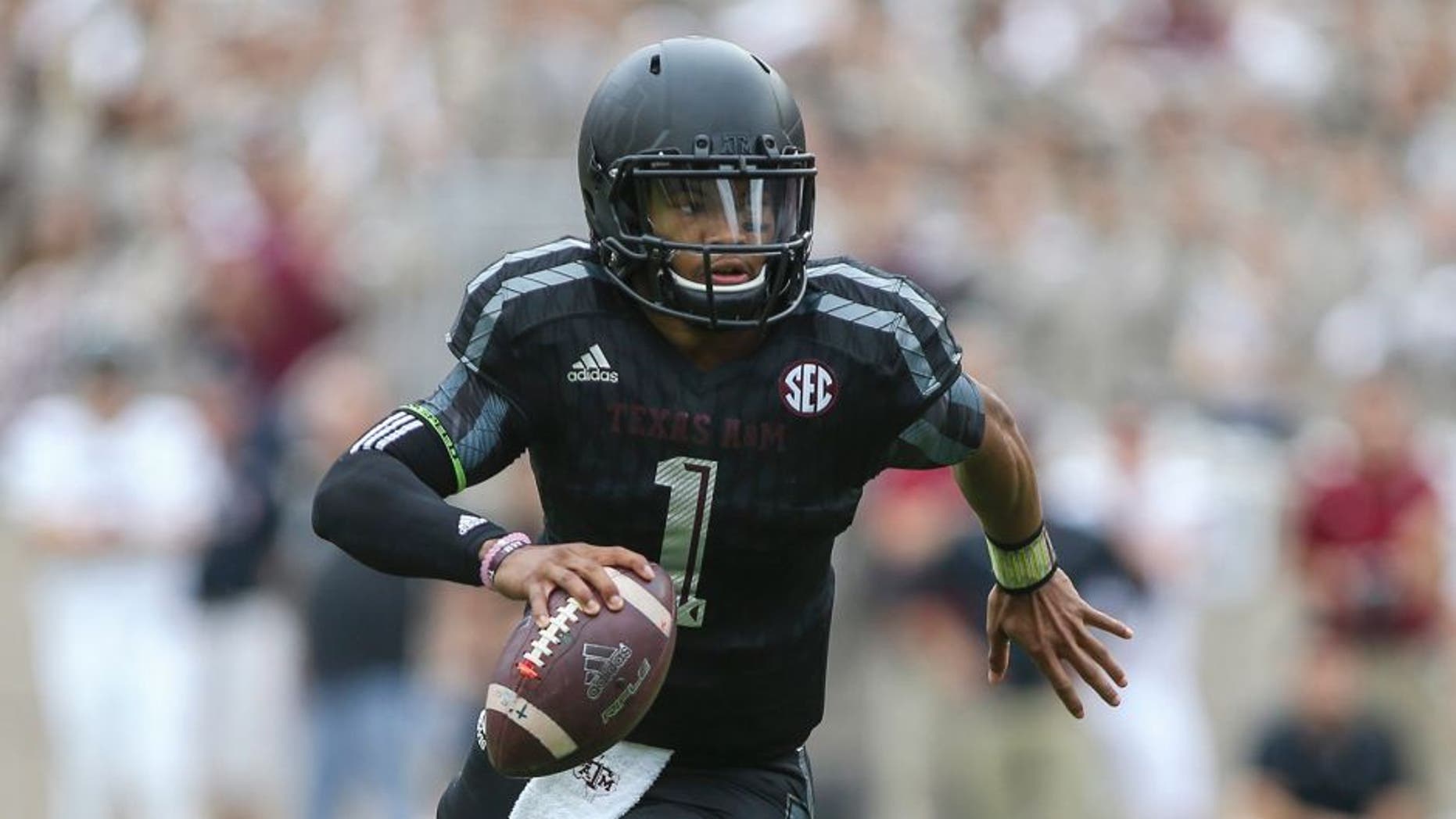 Oct 31, 2015; College Station, TX, USA; Texas A&M Aggies quarterback Kyler Murray (1) scrambles with the ball during the first quarter against the South Carolina Gamecocks at Kyle Field. Mandatory Credit: Troy Taormina-USA TODAY Sports