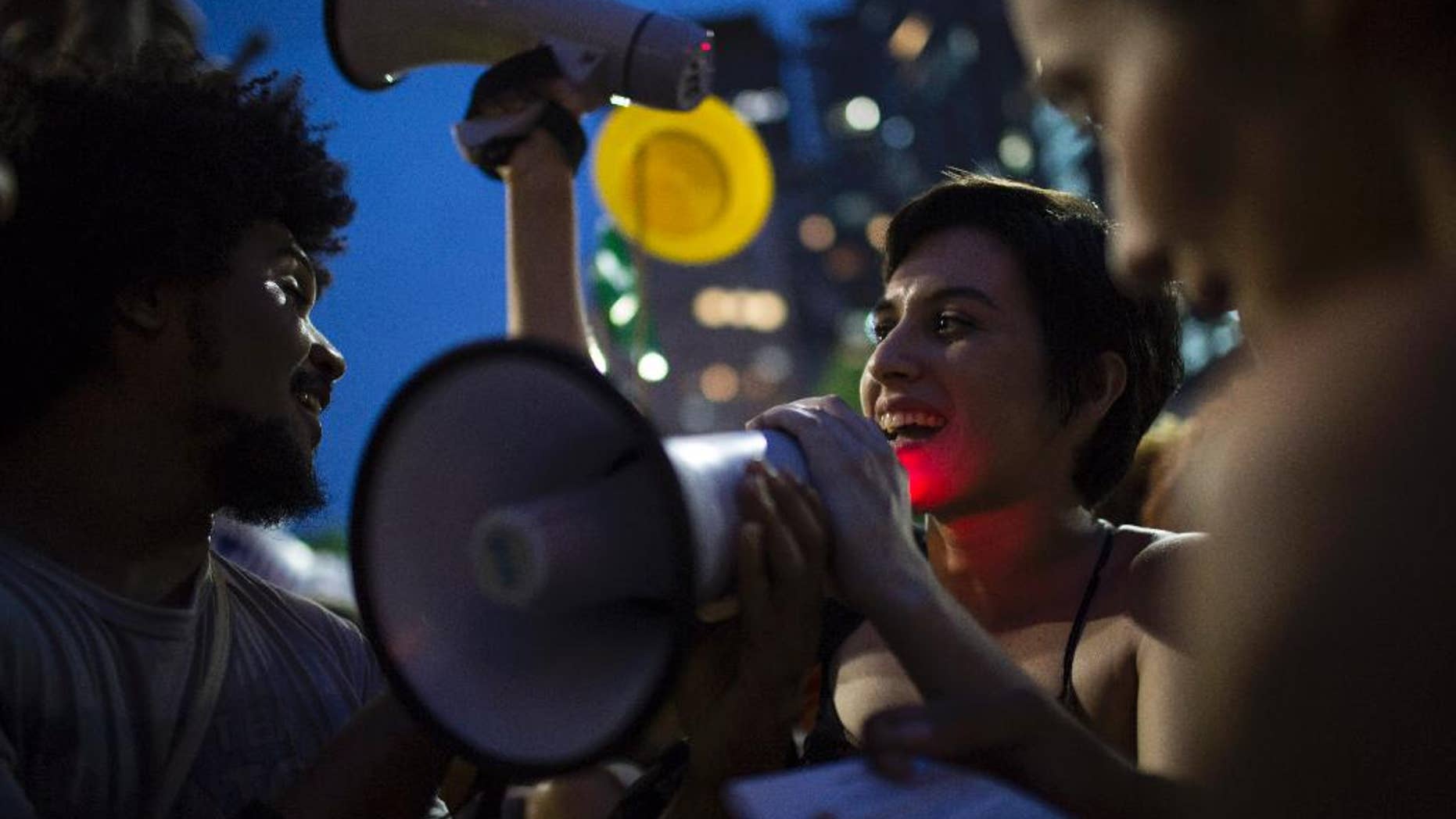 Demonstrators chant slogans during a march in support of Brazil's President Dilma Rousseff and former President Luiz Inacio Lula da Silva in Rio de Janeiro, Brazil, Thursday, March 31, 2016. Rousseff is currently facing impeachment proceedings as her government faces a stalling national economy and multiple corruption scandals. Lula da Silva has been linked to a sprawling corruption scandal involving Brazilian oil giant Petrobras. (AP Photo/Felipe Dana)