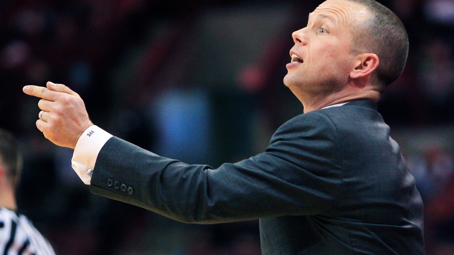 Winthrop head coach Pat Kelsey gestures to his team against Ohio State during the first half of an NCAA college basketball game, Tuesday, Dec. 18, 2012, in Columbus, Ohio. Ohio State won 65-55. (AP Photo/Jay LaPrete)