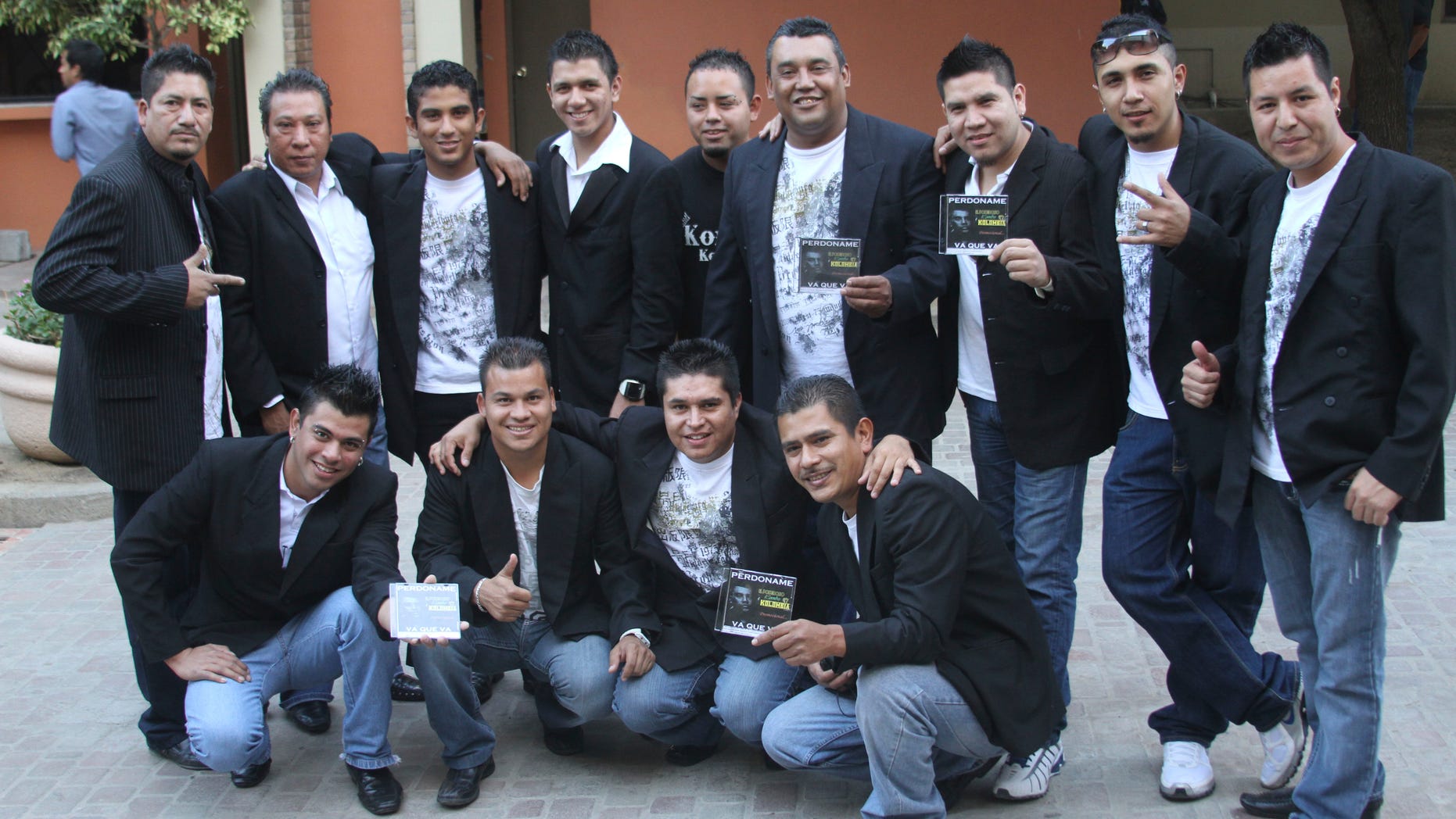 In this Nov. 15, 2011 photo, members of the Colombian style music band Kombo Kolombia pose for the press during a promotional event in Monterrey, Mexico. Sixteen members of the band Kombo Kolombia and four crew members were kidnapped on Friday, Jan. 25, 2013, after playing at a private party held at a ranch called La Carreta, or The Wagon, in the town of Hidalgo north of Monterrey. A member of the band, who managed to escape, led authorities to a well along a dirt road where searchers found several bodies which, authorities said on Monday, Jan. 28, all indicates that they belong to the missing band members. (AP Photo)