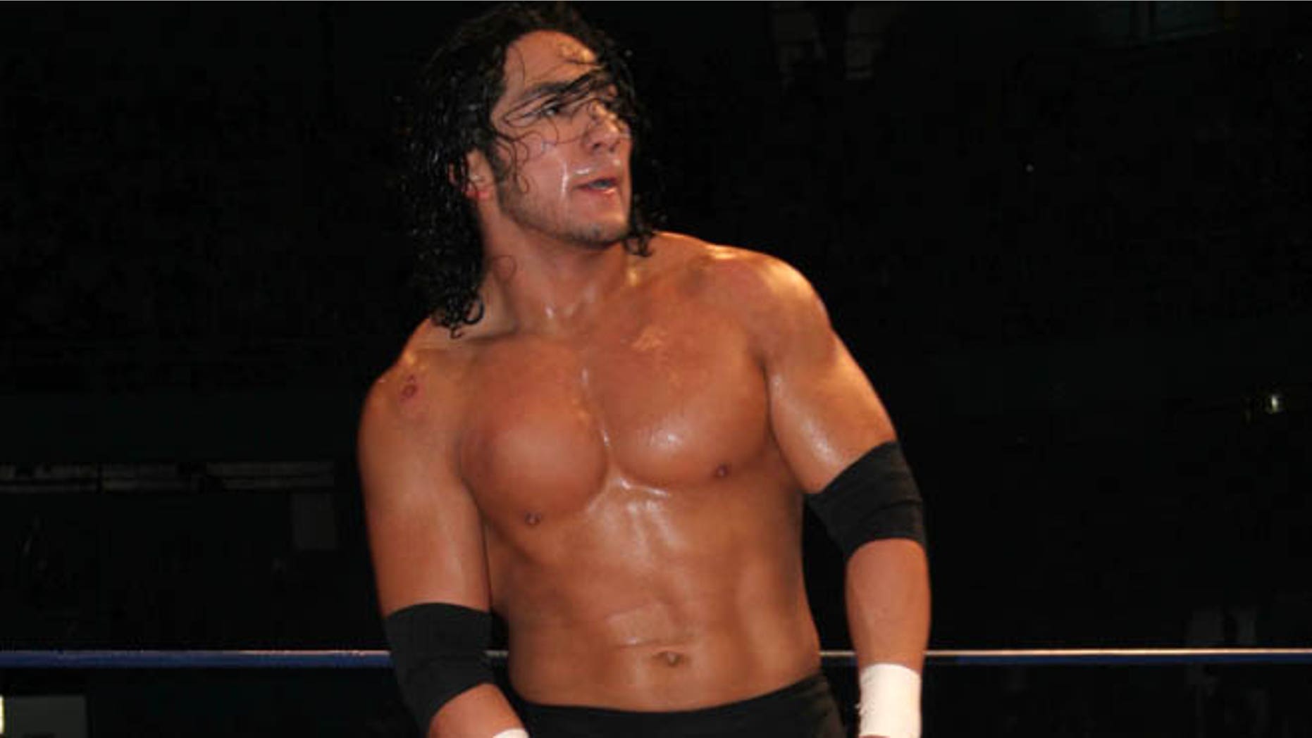 In this April 13, 2007 photo, Mexican wrestler Pedro Aguayo Ramirez, known as Hijo del Perro Aguayo, top, tries to remove the mask of Mistico during a wrestling match in Mexico City. Ramirez, the son of a wrestling legend in the country, died early Saturday March 21, 2015, from a hit suffered in the ring in Tijuana, the Baja California state prosecutor's office said. (AP Photo/Ezequiel Tlaxcala-CUARTOSCURO.COM) MEXICO OUT - NO PUBLICAR EN MEXICO - MANDATORY CREDIT - CREDITO OBLIGATORIO